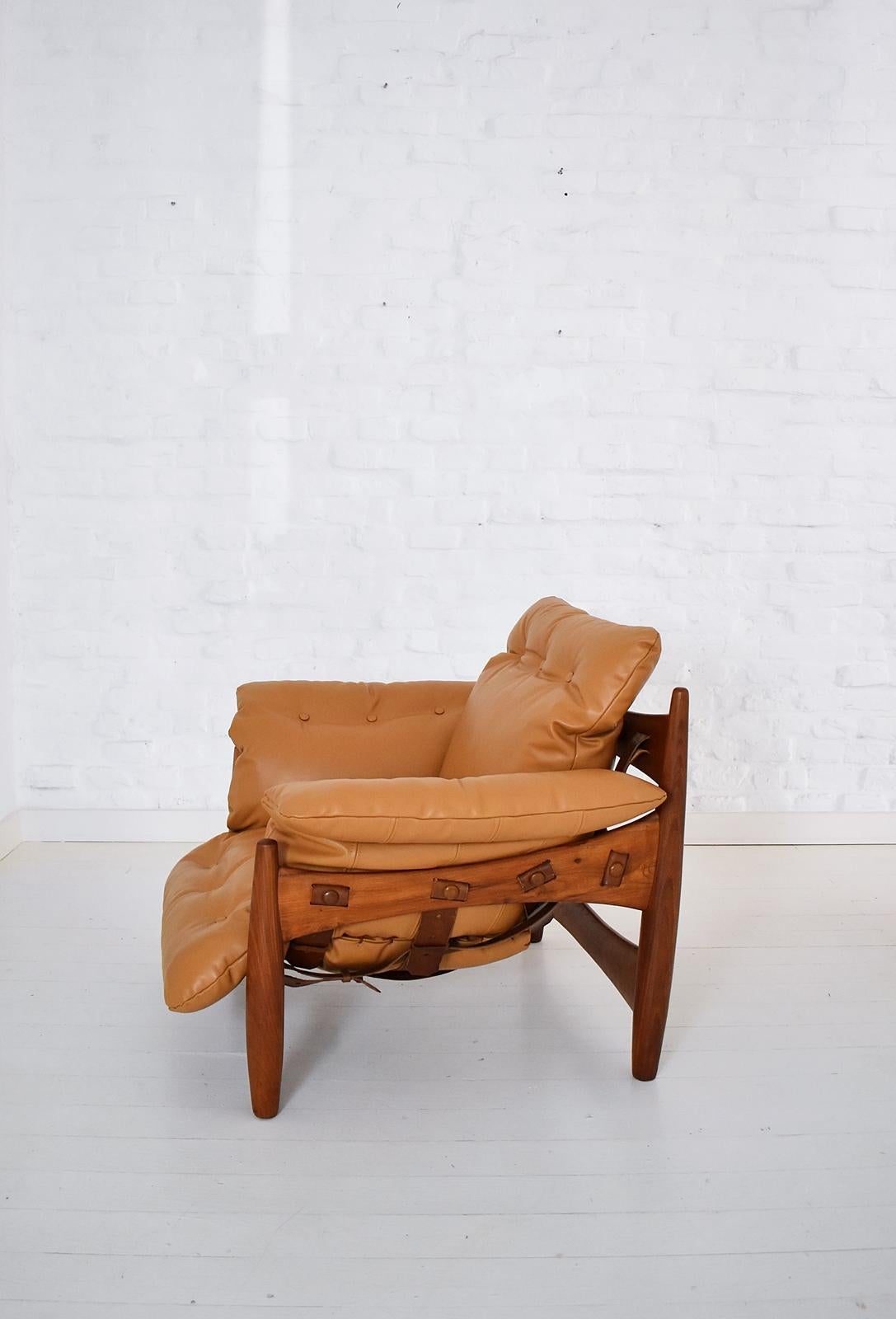 Sheriff armchair by Sergio Rodrigues. Originally nick-named the POLTRONA MOLE or soft chair due to its decidedly relaxed style and large loose cushion, it later became known as the Sheriff chair, the leather cushion supported by leather strap and
