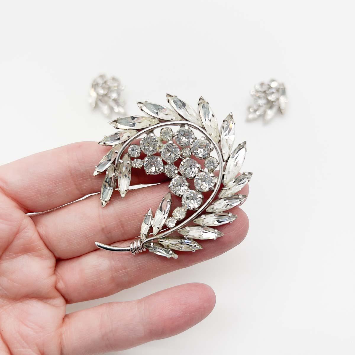 A beautiful Vintage Sherman Floral Navette Brooch and Earring Set. Divine navette 'crystals in fancy cuts form a sweeping style statement, the suite comprising a perfectly proportioned brooch with earrings. The perfect chic ensemble that will be