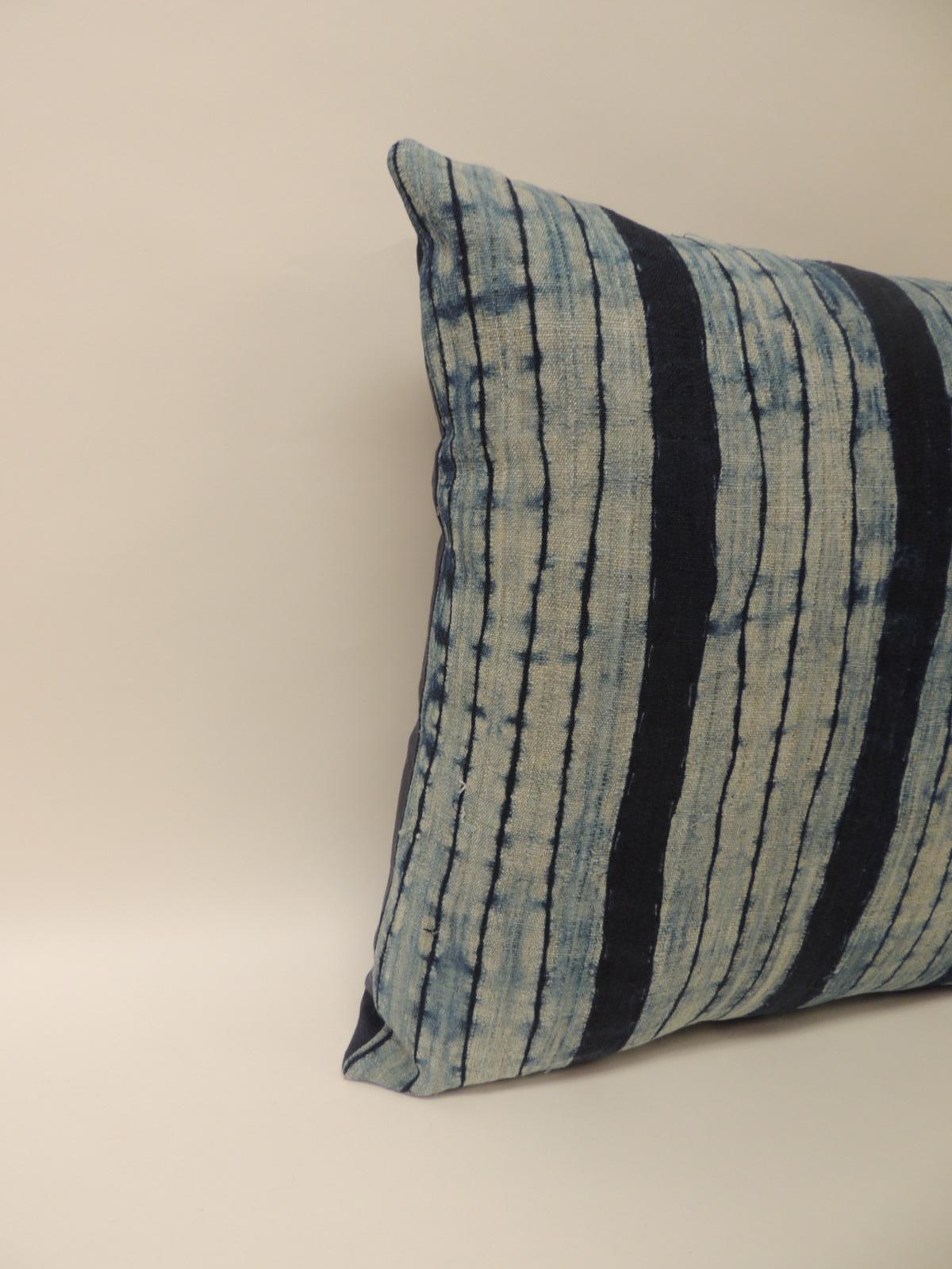 Vintage Shibori stripe blue Asian decorative pillow. Square indigo stripe homespun hemp textile with dark blue linen backing.
Decorative pillow handcrafted and designed in the U.S. 
Throw bolster pillow with a custom made pillow insert and closure
