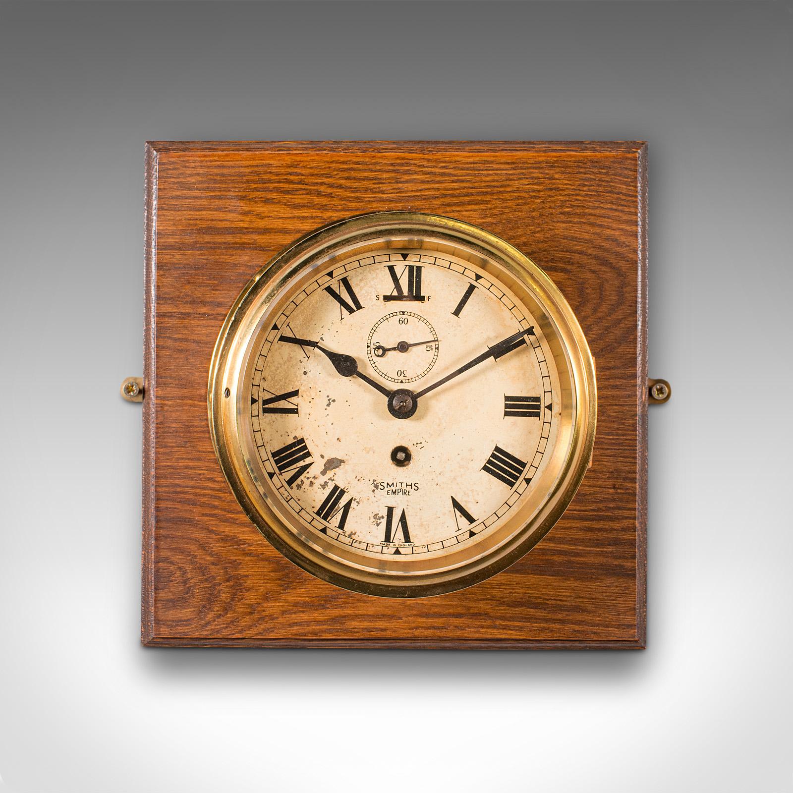 This is a vintage ship's bulkhead clock. An English, brass over oak maritime timepiece, dating to the early 20th century, circa 1930.

Attractive presentation to this time-served clock
Displays a desirable aged patina and in good order
Polished
