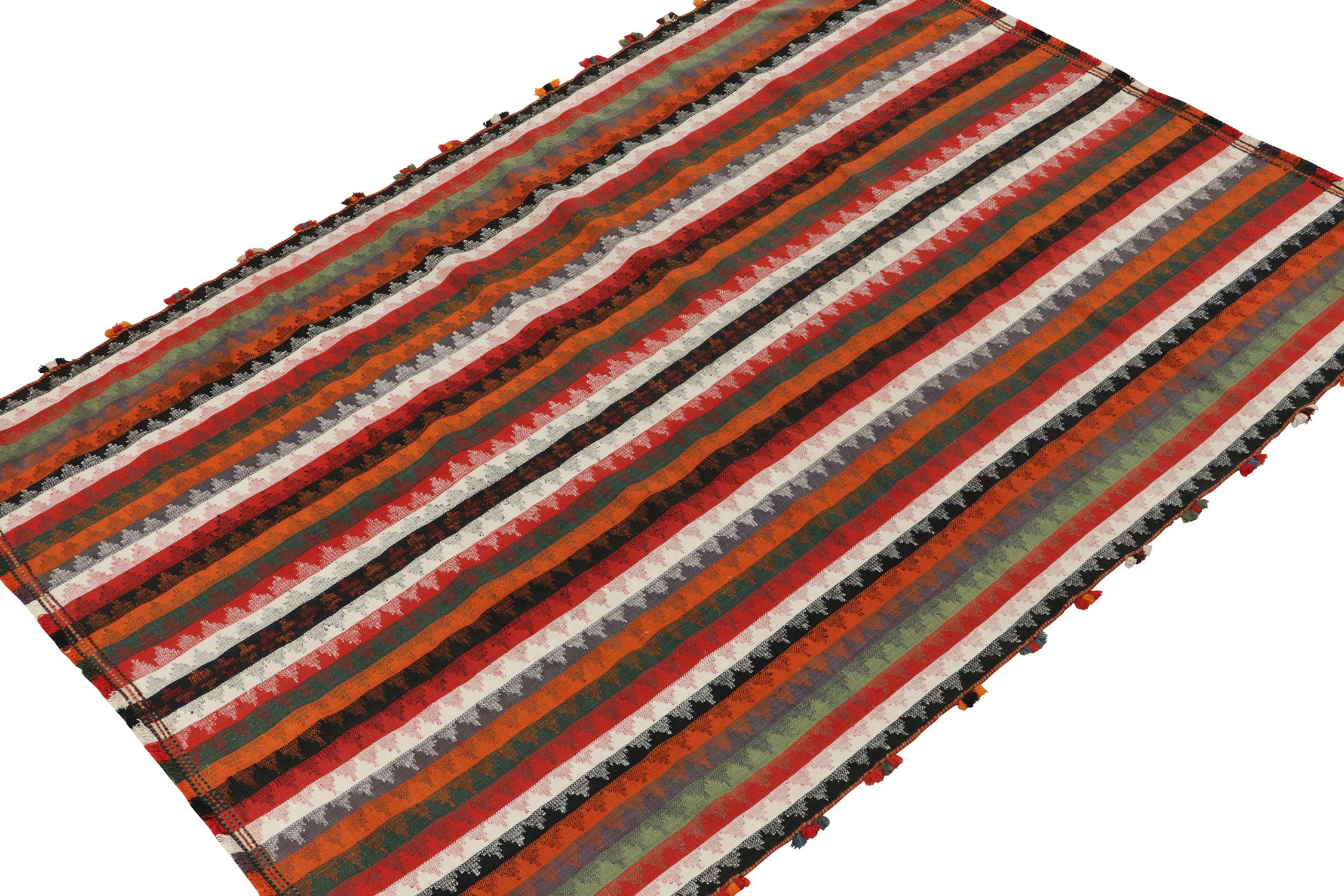 This vintage 6x8 Persian Kilim is a Shiraz rug, and an exemplar of this tribal provenance. Handwoven in wool, it originates circa 1950-1960.

Further On the Design: 

This Shiraz Kilim enjoys polychromatic stripes and subdued geometric patterns
