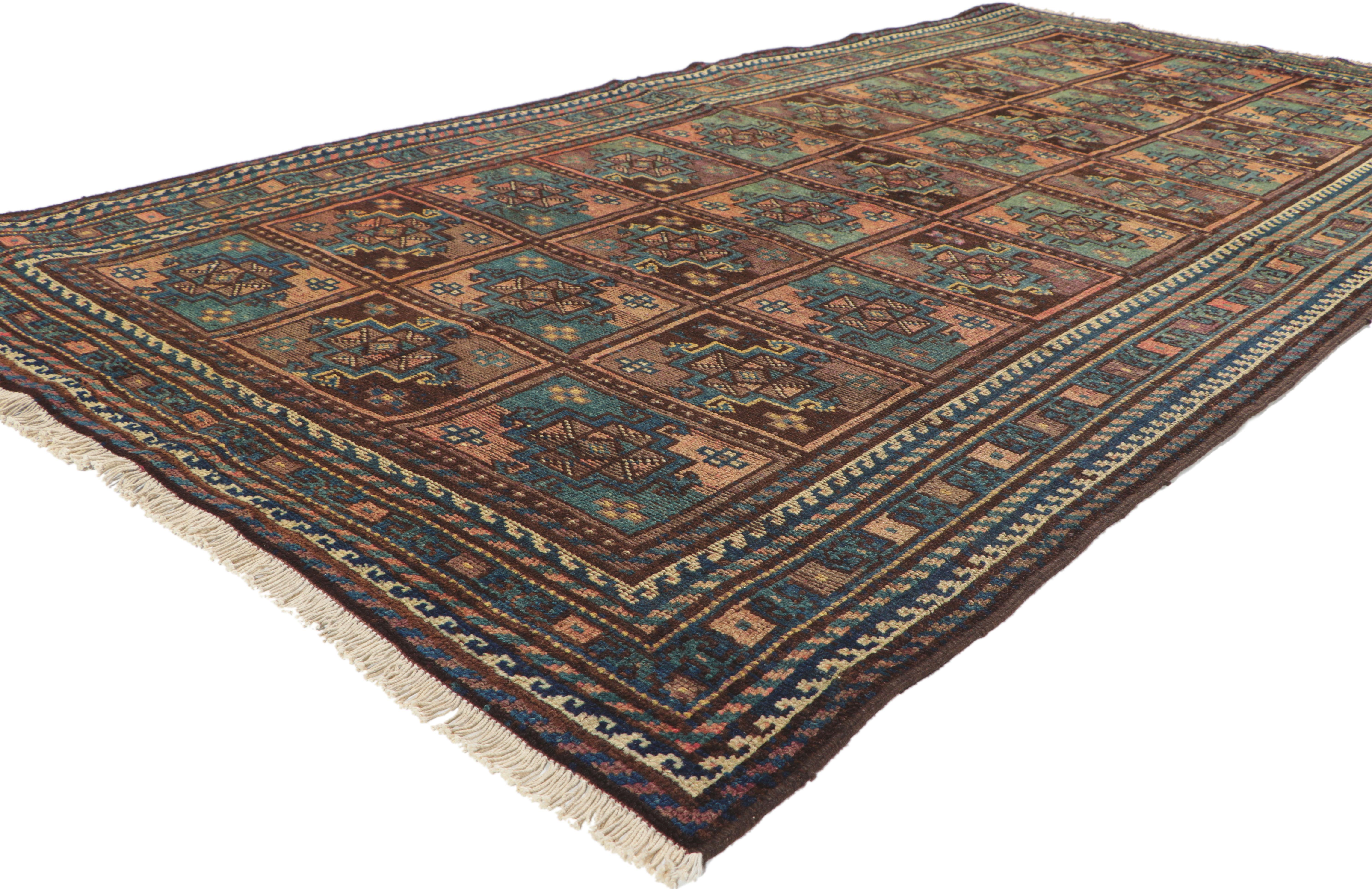 76432 Vintage Persian Shiraz Rug, 04'05 x 08'10. 
Full of tiny details with incredible detail and texture, this hand-knotted wool vintage Shiraz Persian rug is a captivating vision of woven beauty. The eye-catching garden design and earthy colorway