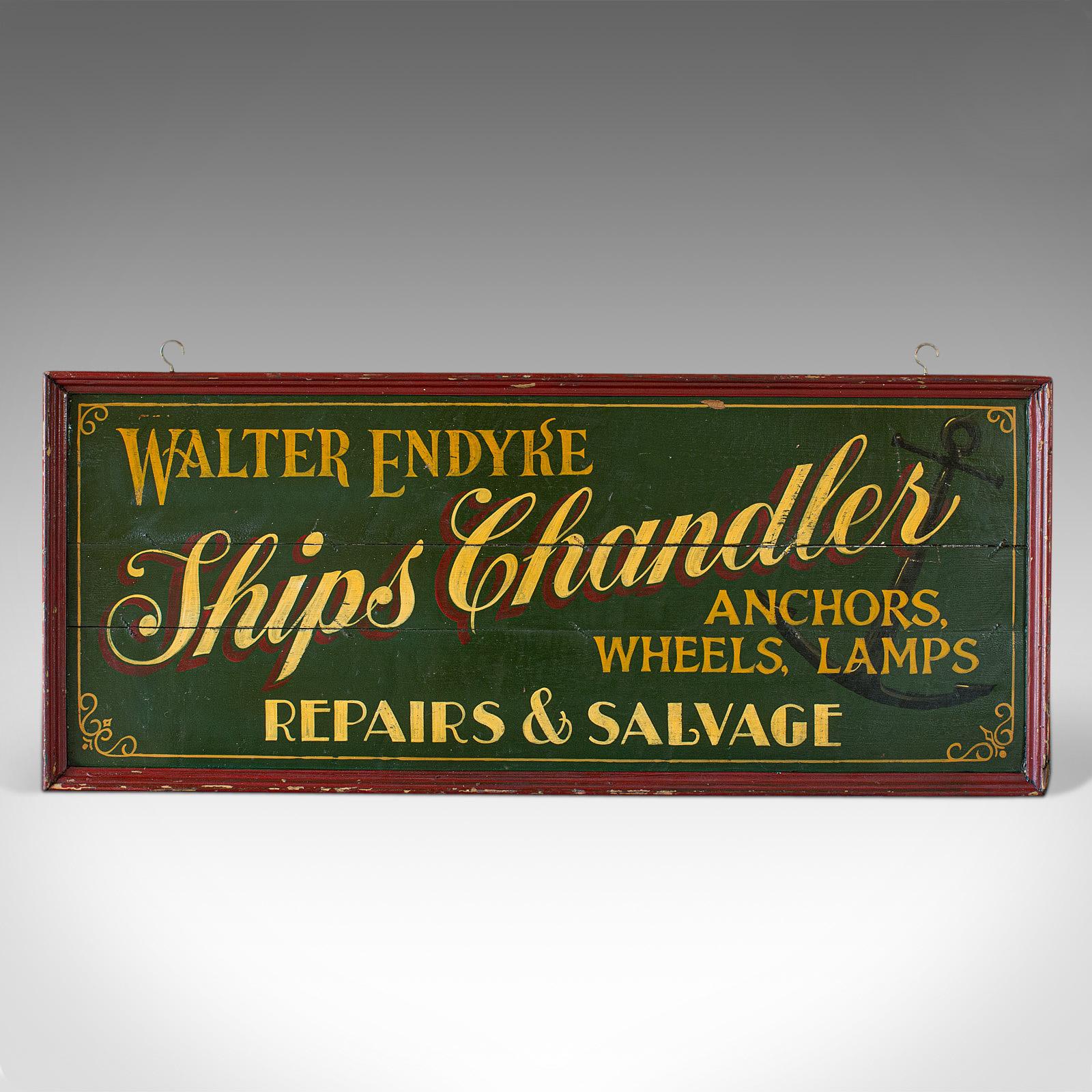 This is a vintage shop sign. An English, pine chandlers billboard with hand painted sign writing, dating to the early 20th century, circa 1930.

Attractive period shop sign
Displays a desirable aged patina
Stocks of pine presented in deep green