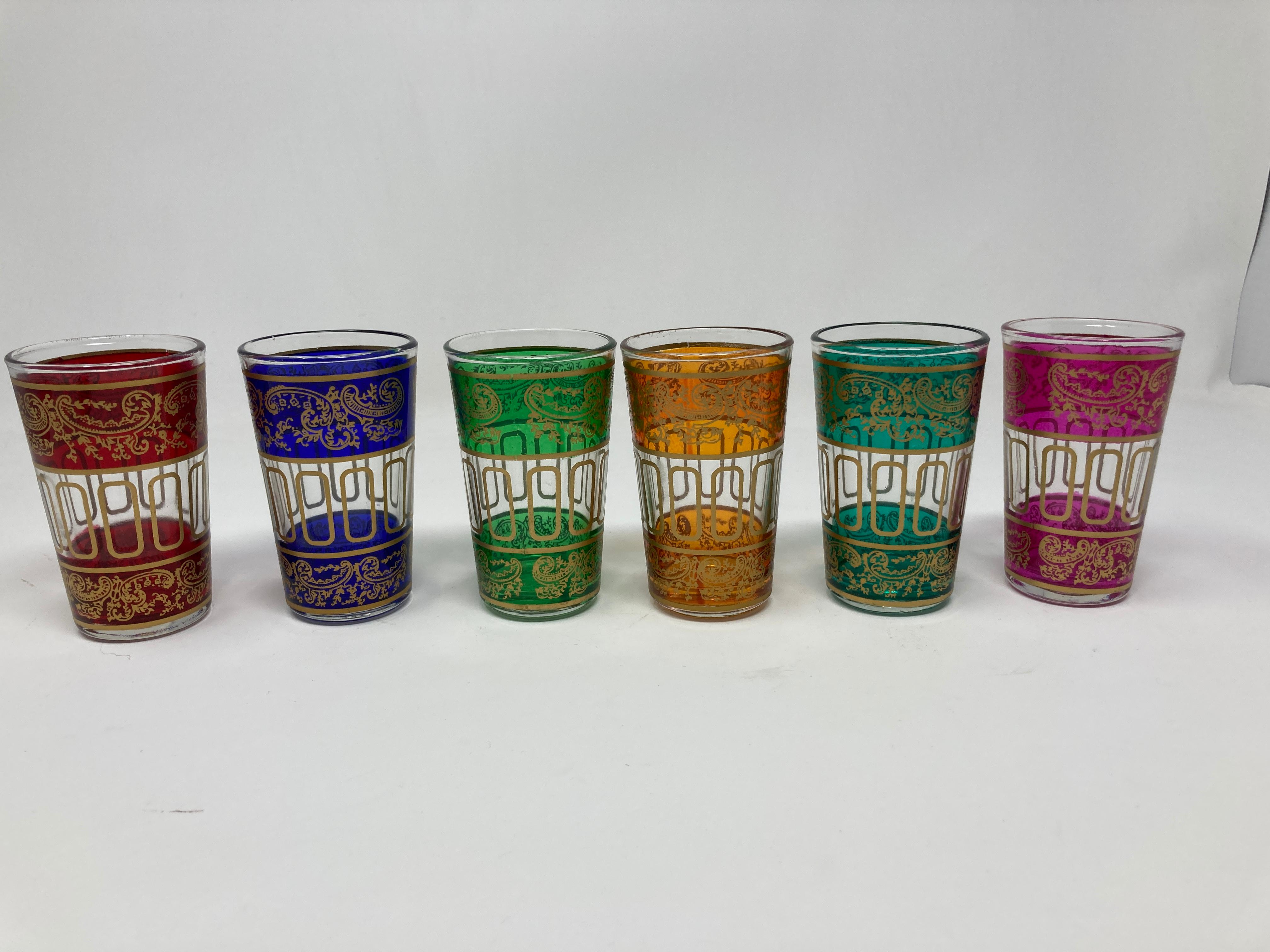 Set of six vintage Moroccan colored shot glasses with gold raised Moorish design.
Decorated with a classical gold and pattern Moorish frieze.
Use these elegant vintage shot glasses for Moroccan tea, or any hot or cold drink.
Perfect for the