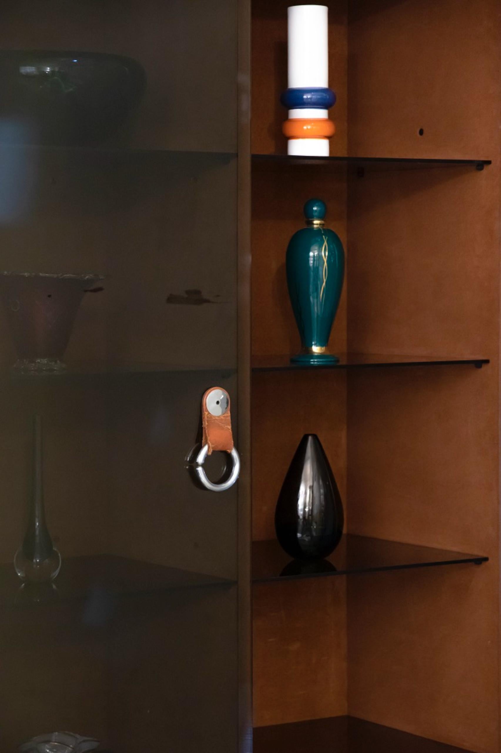 Faleschini Showcase is an original decorative object designed by Guido Faleschini and produced for Hermes in the 1970s.

Made in Italy.

Total dimensions: 170 x 45 x 100 cm. 

Very good conditions. 

Guido Faleschini. He obtained the diploma