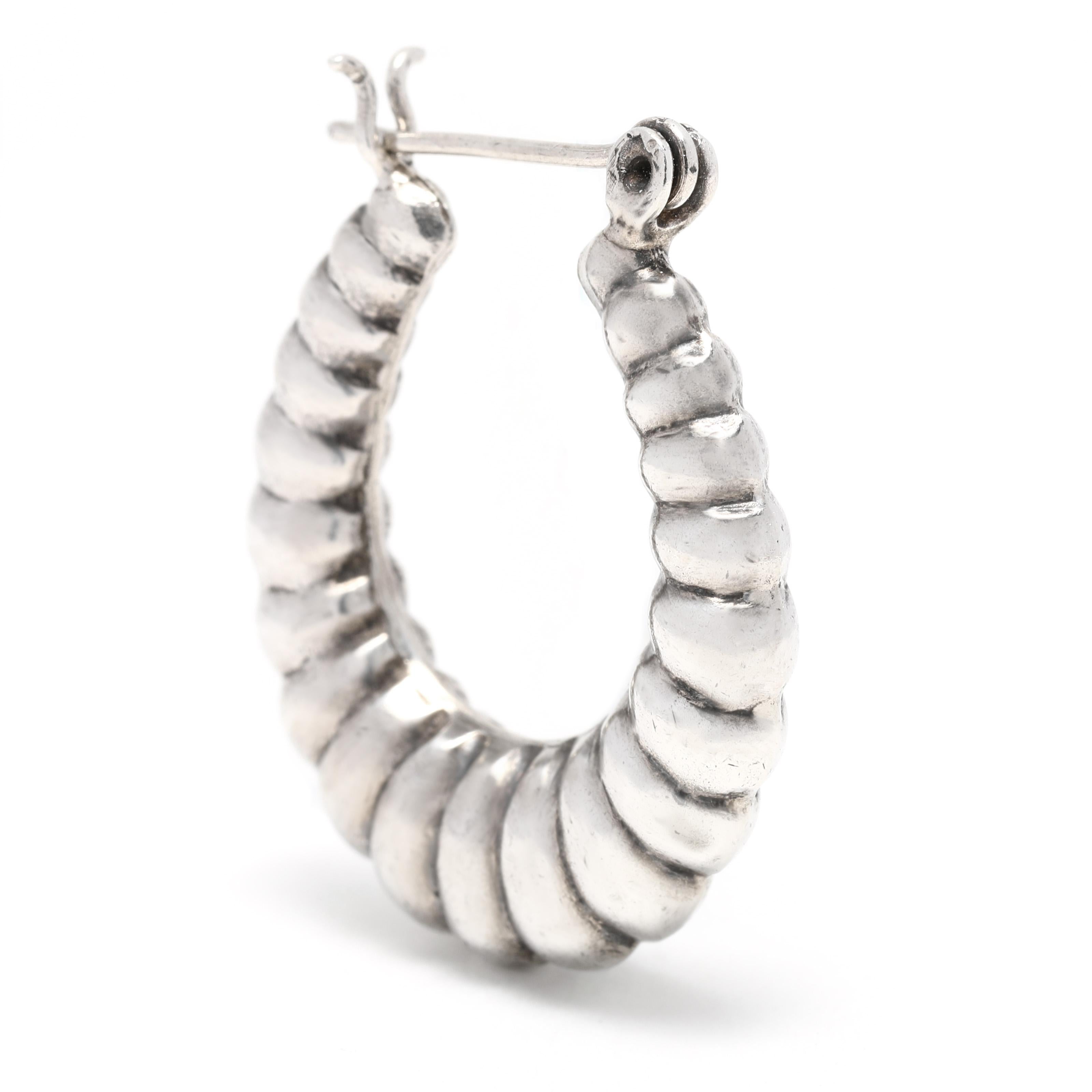 These stunning vintage shrimp hoop earrings are perfect for adding a touch of elegance to any outfit. Crafted in sterling silver, these earrings have a length of 1.24 inches and feature a classic hoop design for a timeless look. These vintage silver