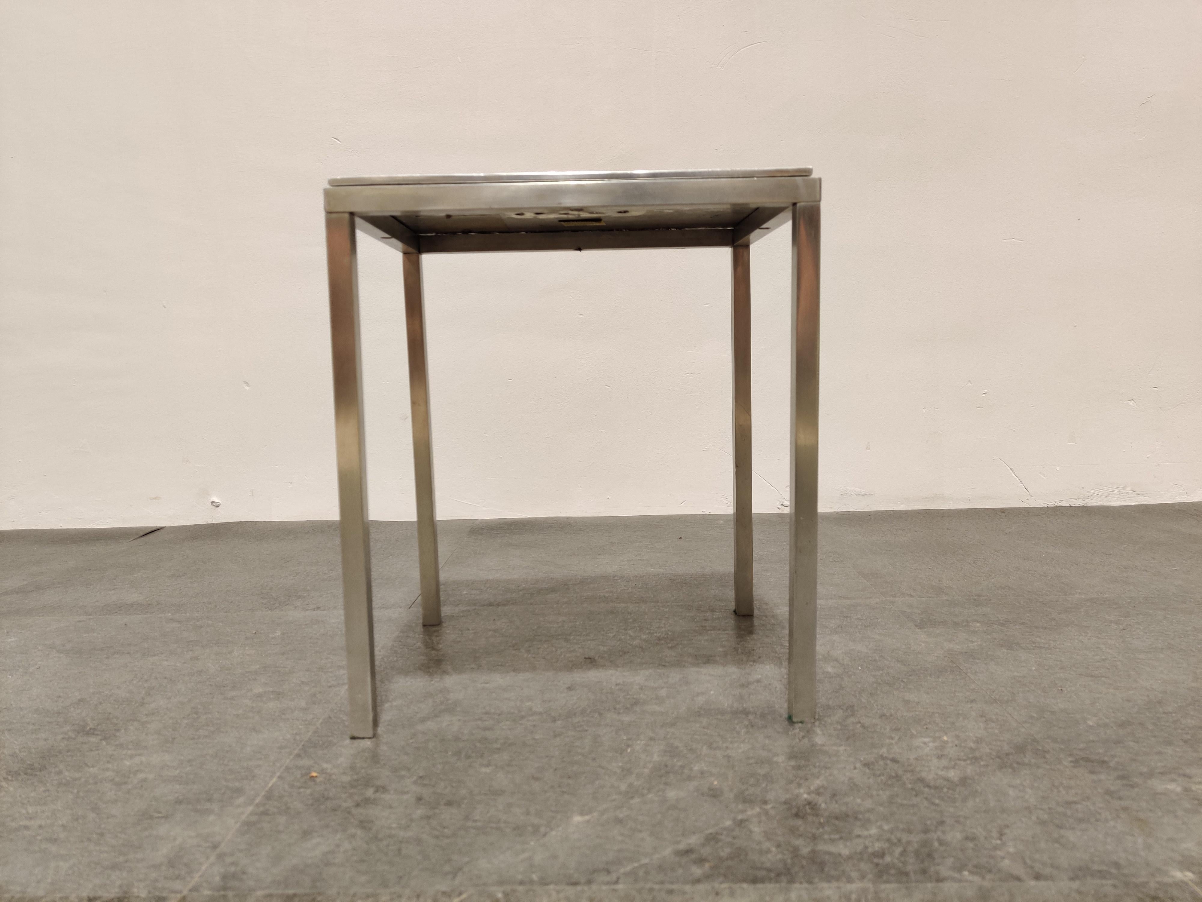 Midcentury side table by Willy Luyckx for Aluclair.

Hand forged table top.

Labeled underneath.

Cool decorative side table.

1970s - Belgium

Good condition

Measures: Height 35cm/13.77