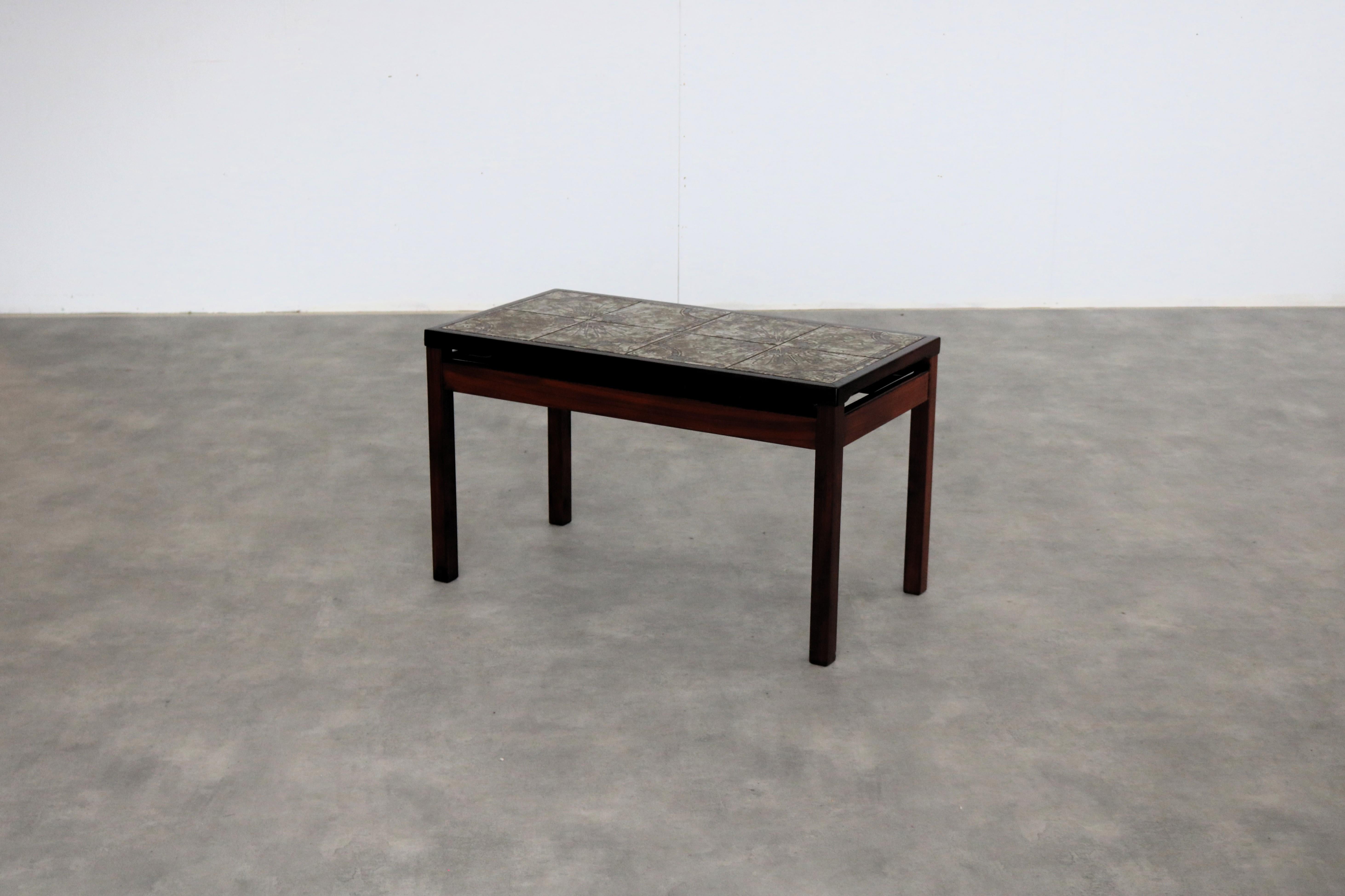 Vintage side table  coffee table  1960s  Danish

Period  1960s
Design  Unknown  Denmark
Condition  Good  Minor signs of wear
Size  50 x 85 x 45 cm (H x W x D)

Details  wood; Ceramic

Item number  2935