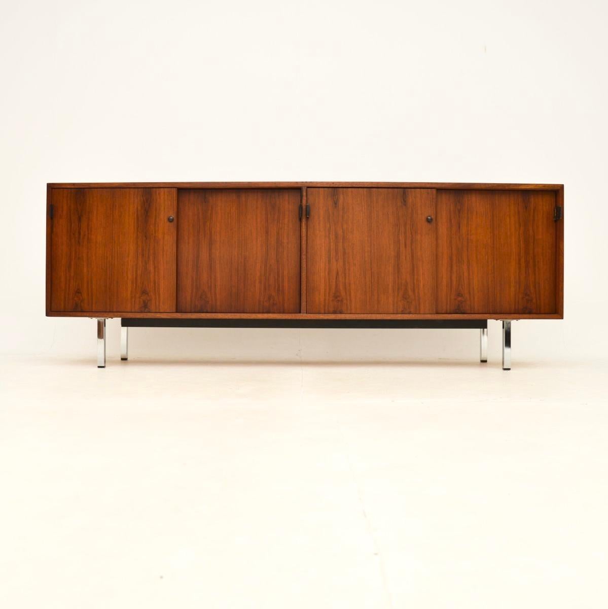 A stylish and extremely well made vintage sideboard by Florence Knoll. It was made by Knoll International, it dates from around the 1960-70’s.

It is of superb quality, beautifully crafted with chrome legs and a sycamore interior. This has gorgeous