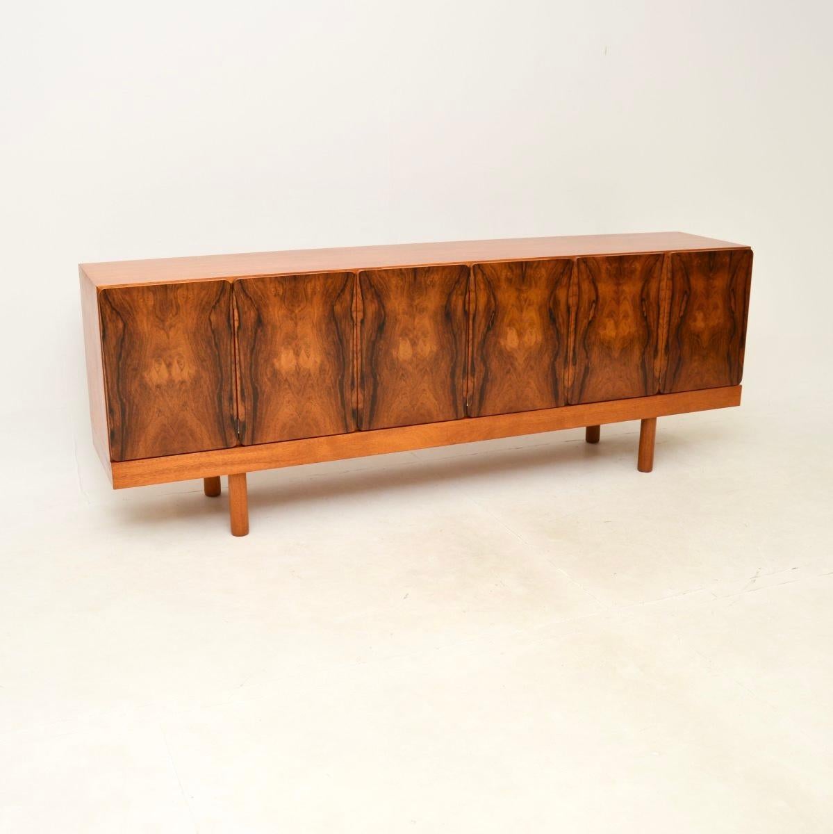 A rare and extremely beautiful vintage sideboard by Gordon Russell. This was made in England, it dates from the 1960’s.

The quality is outstanding, this is a great size with lots of useful storage space. The doors are beautifully curved at the