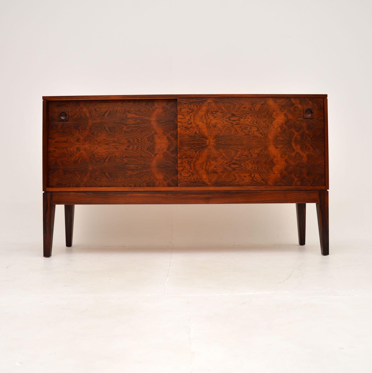 A stunning vintage sideboard by Robert Heritage for Archie Shine. This was made in England, it dates from the 1960’s.

It is of amazing quality and is a very useful size, the grain patterns and colour tones are absolutely gorgeous. The two sliding