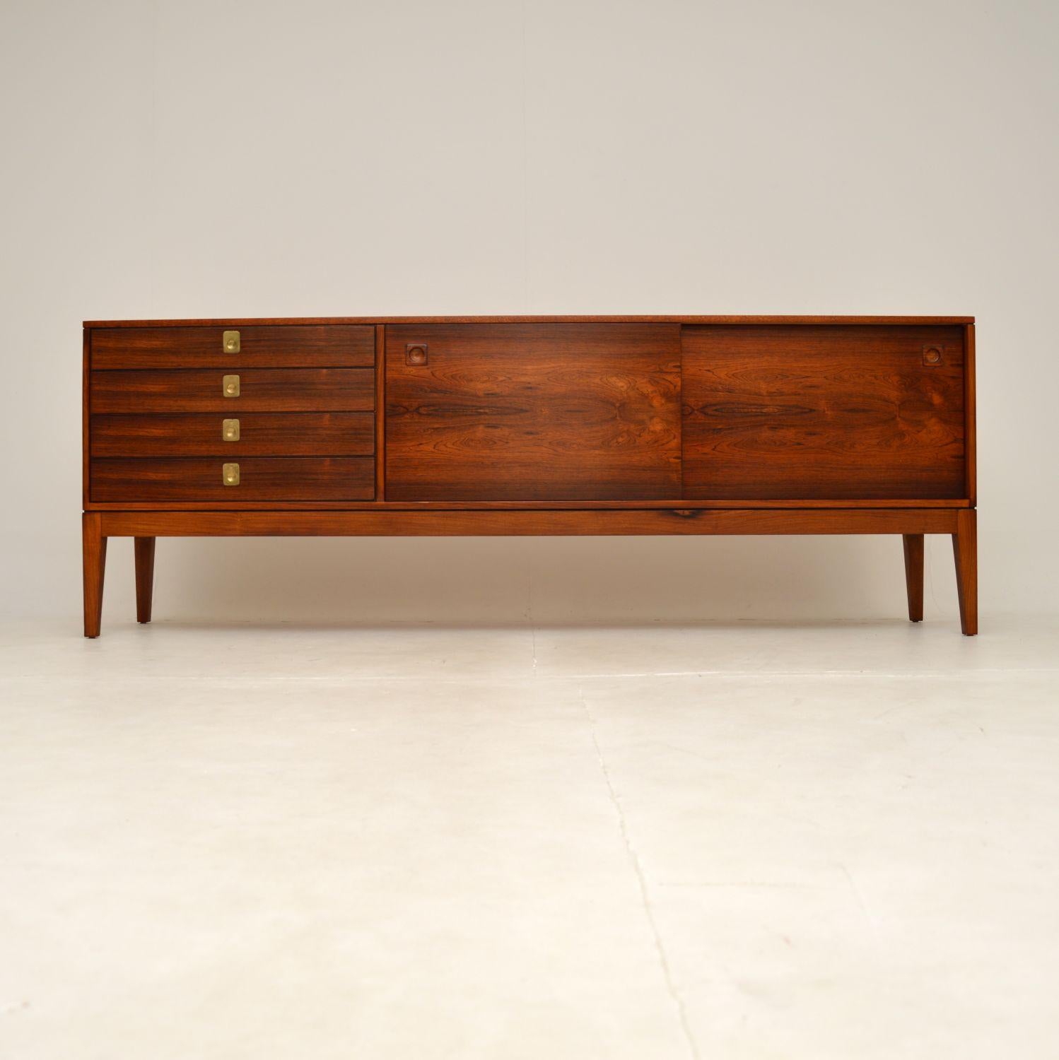 An absolutely stunning and extremely well made vintage sideboard by Robert Heritage for Archie Shine. This was made in England, and dates from the 1960’s.

The quality is outstanding, this sits on beautifully tapered legs, with two sliding doors on