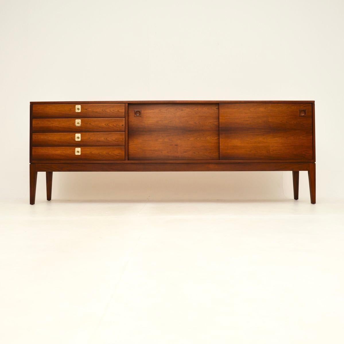 An absolutely stunning and extremely well made vintage sideboard by Robert Heritage for Archie Shine. This was made in England, and dates from the 1960’s.

The quality is outstanding, this sits on beautifully tapered legs, with two sliding doors on