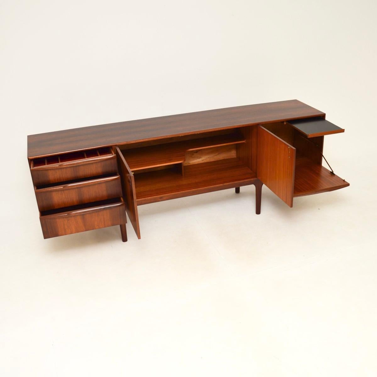A very stylish and highly sought after vintage sideboard by McIntosh. This model is called the Dunfermline, it was designed by Tom Robertson and made in Scotland in the 1960’s.

It is of superb quality and is beautifully designed, with gorgeous