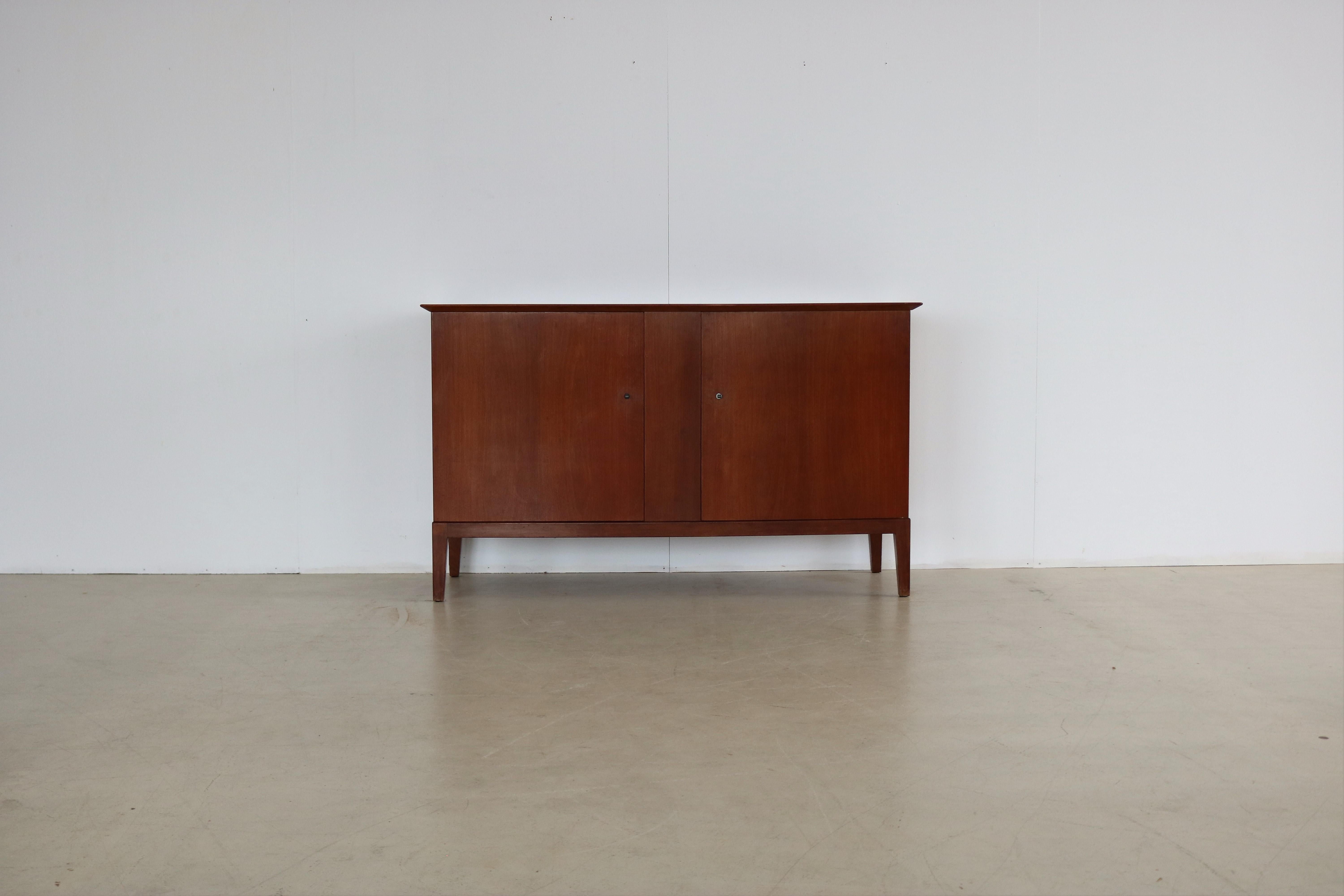 vintage sideboard  dresser  1940s  Fritz Hansen

period  1940s
designs  Fritz Hansen  Denmark
conditions  good  light signs of use
size  85.5 x 143.5 x 52.5 (HxWxD)

details  mahogany; matching cabinet available;

article number  1877