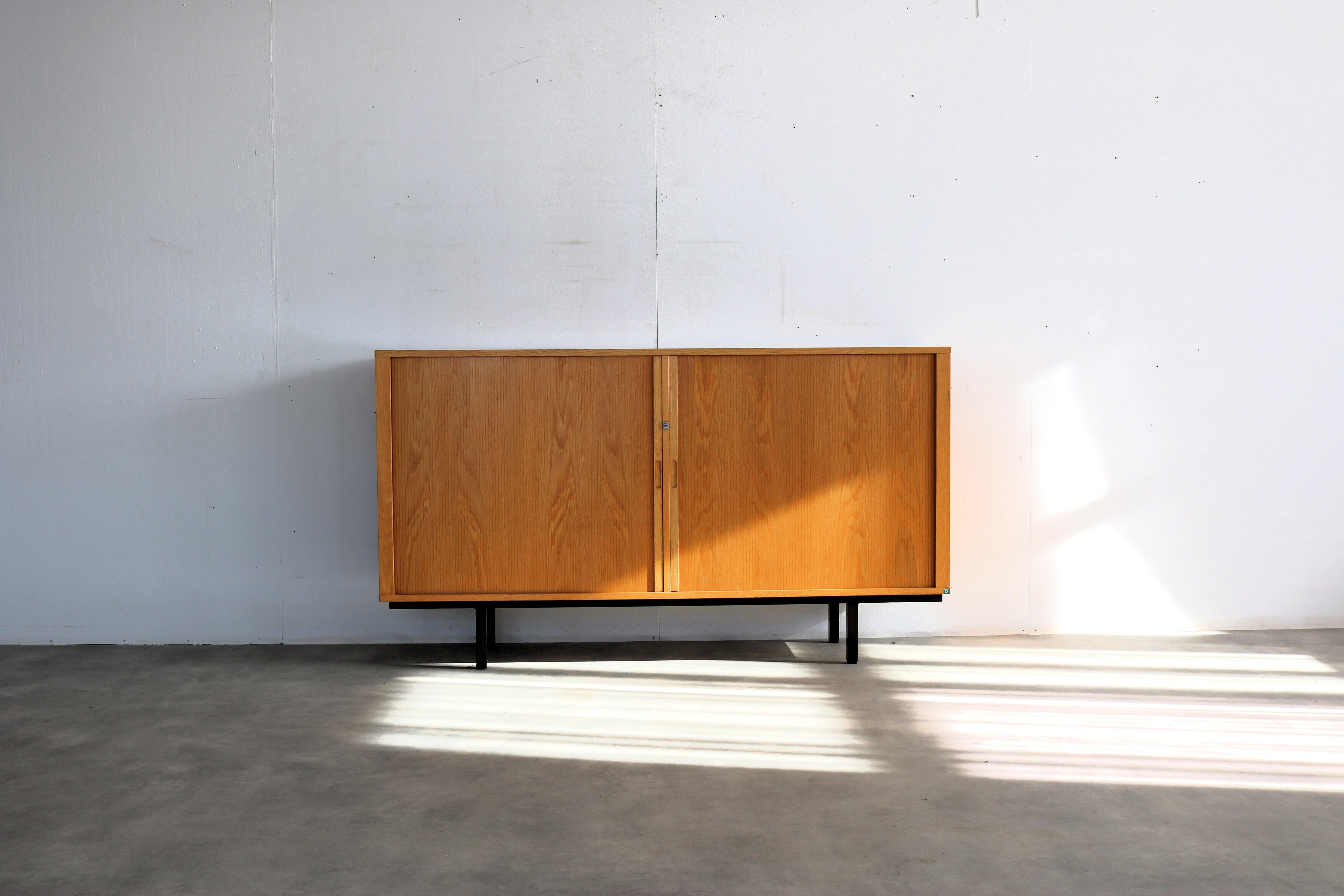 vintage sideboard  dresser  tambour  60s  Danish

period  60's
design  Dana  Denmark
condition  good  light signs of use  key is missing
size  93 x 165 x 42 (hxwxd)

details  metal; oak; tambour sliding door;

article number  2694