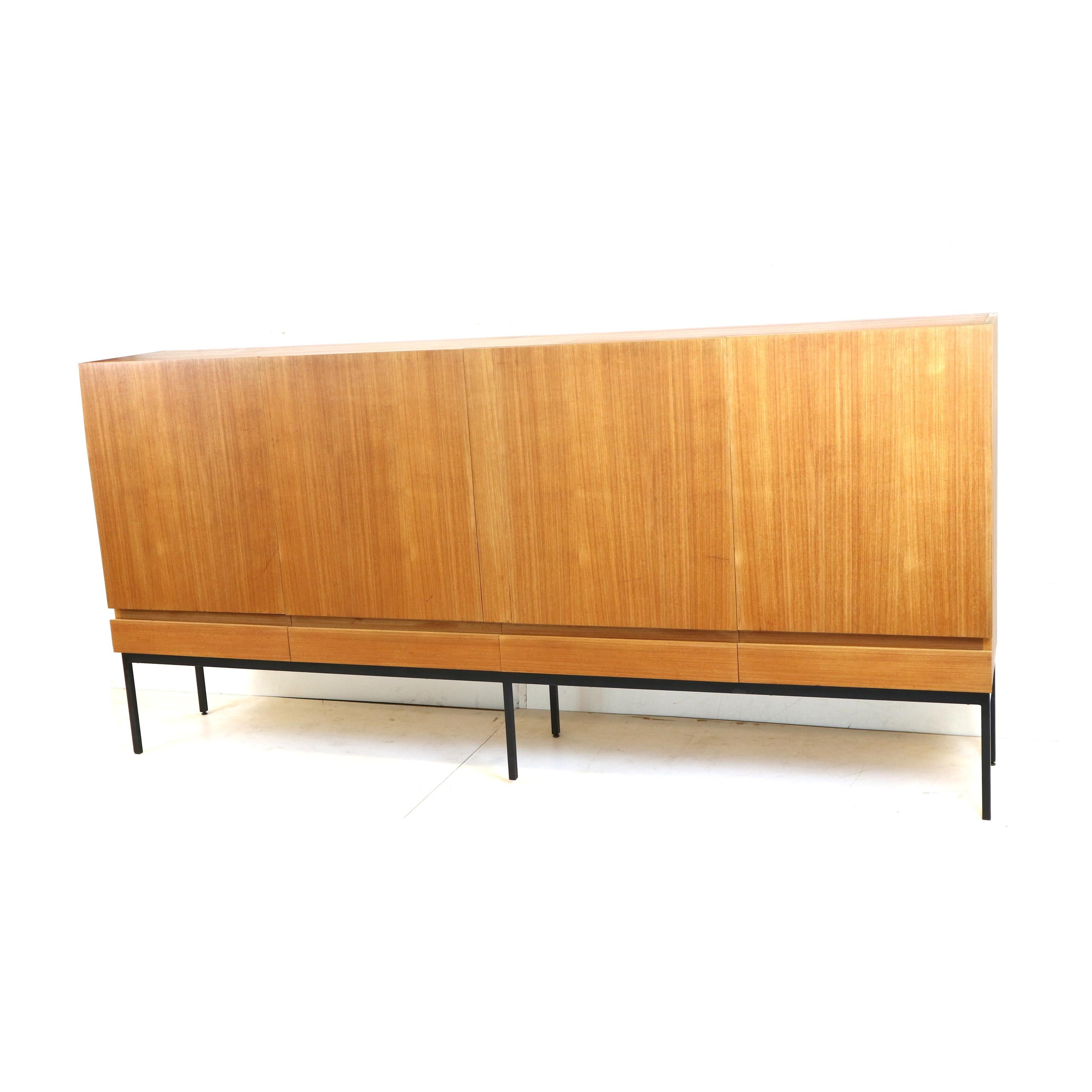 Vintage sideboard / highboard Dieter Waeckerlin B60 for Behr from the 1960s.

Minimalist design piece made of teak wood with polished frame.
The B60 was designed by Dieter Waeckerlin in 1958 and manufactured by Behr Möbel in 1962

Dieter Waeckerlin