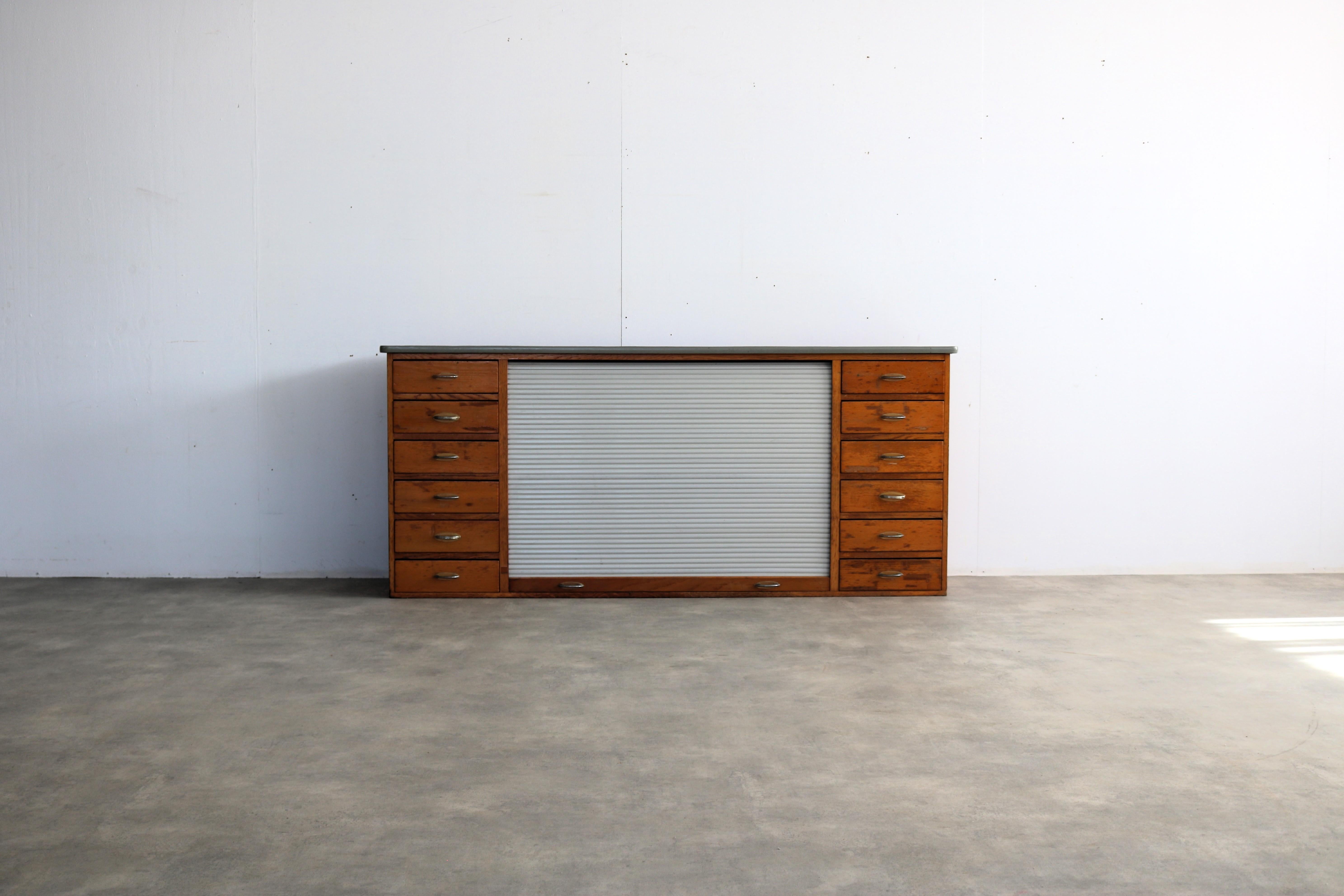 vintage sideboard  school cupboard  1960s  cupboard

period  1960s
design  unknown
condition  good with signs of use/patina/veneer restoration
size  76.5 x 174 x 37 (hxbxd) 

details  oak; plastic; chrome; tambour roller door;

article number  2710