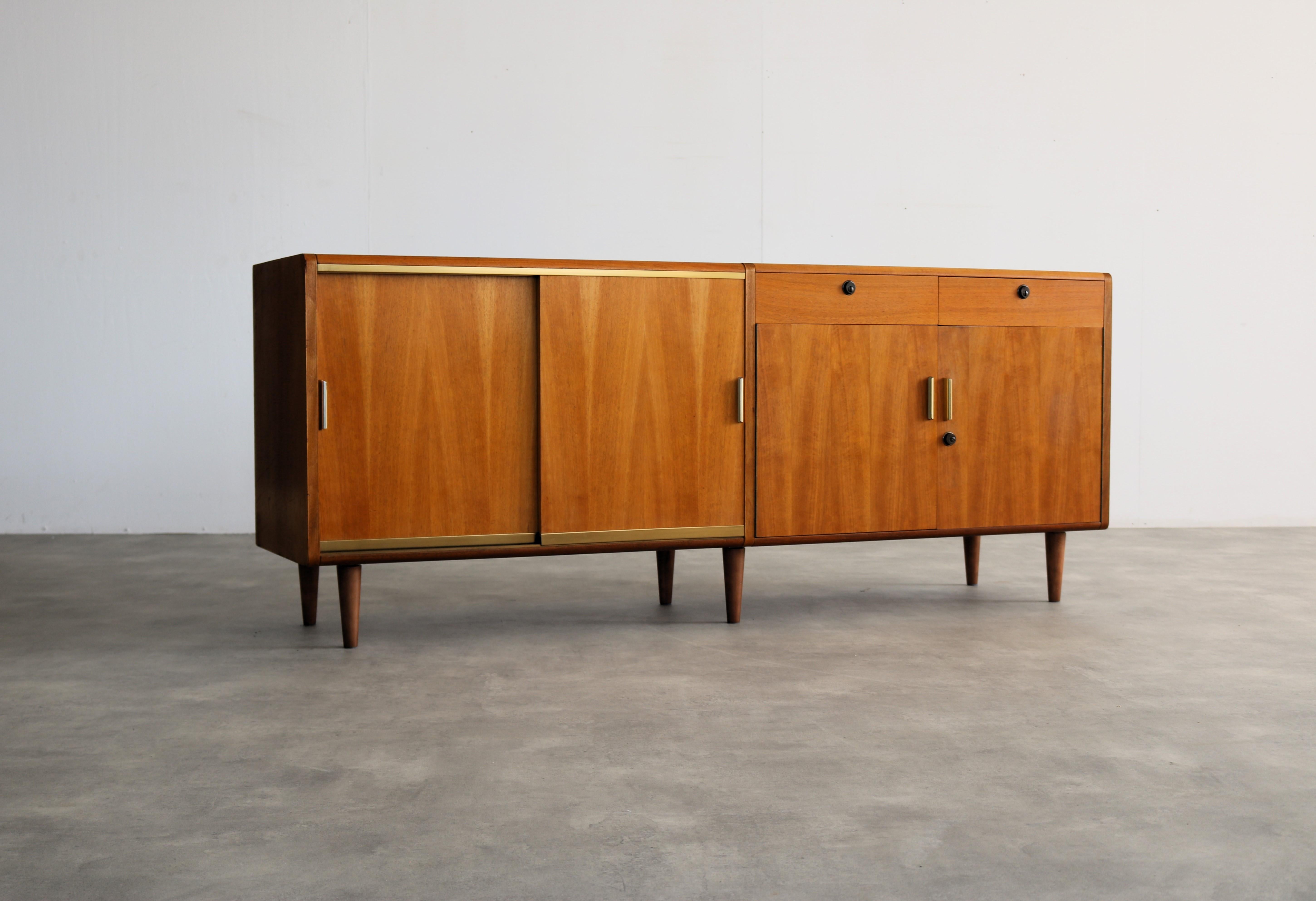 
vintage sideboard  sideboard  60s  Patin

period  60's
design  A.A. Patin  The Netherlands
condition  good  light signs of use  key missing; door lock defective due to broken key;

size  72 x 176.5 x 44 (hxwxd)

details  teak; brass; legs are not