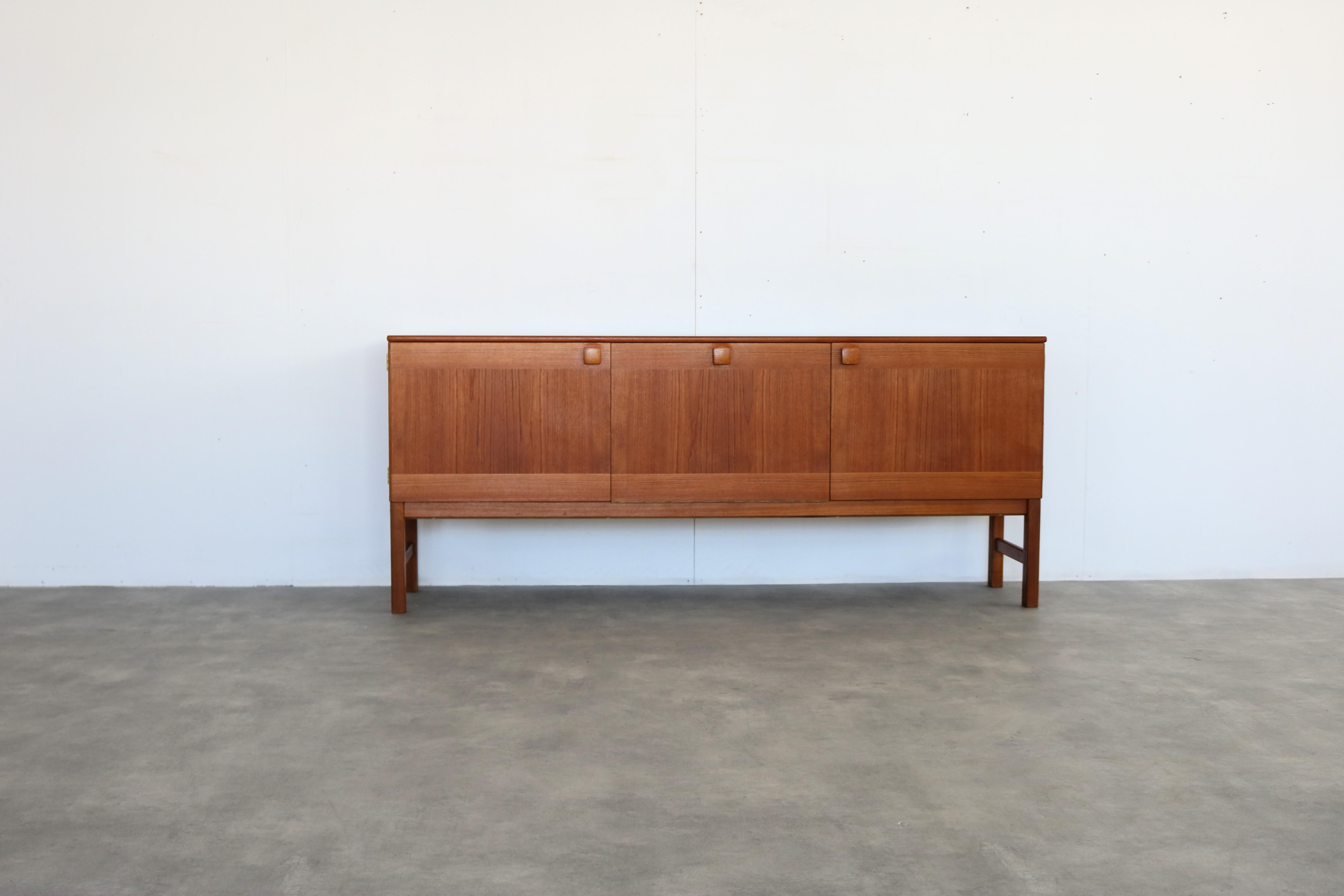 vintage sideboard  sideboard  teak  1960s  Swedish

period  1960s
design  unknown  Sweden
condition  good  minor signs of use
size  74.5 x 178 x 43 (hxbxd) 

details  teak;

item number  2825