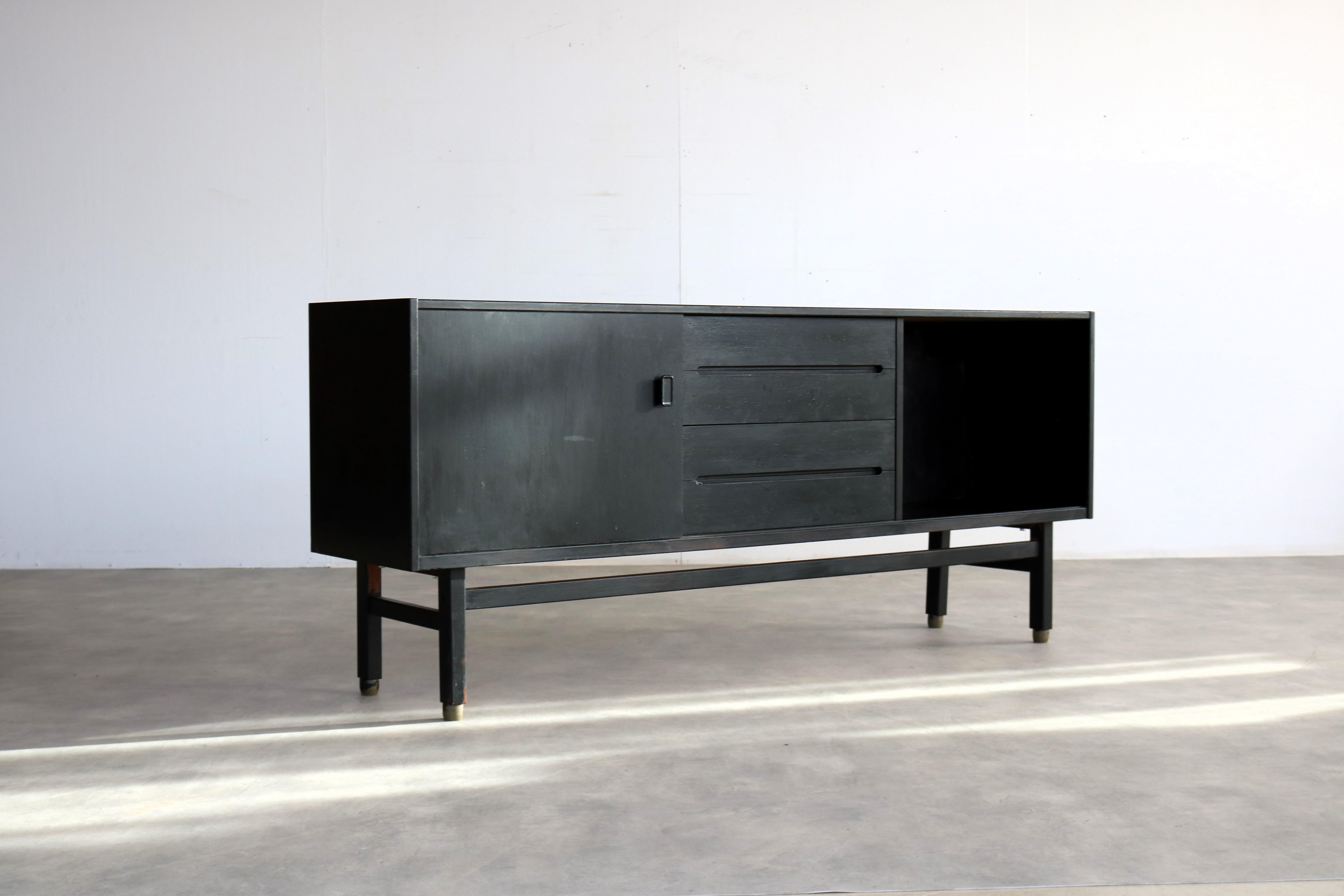 vintage sideboard   sideboard  Troeds  60s  Sweden

period  60's
design  Nils Jonsson  Troeds  Sweden
condition  good with signs of wear/patina  black lacquered wood
size  82 x 190 x 43 (hxwxd)

details  teak; rubber; model Arild

article number 