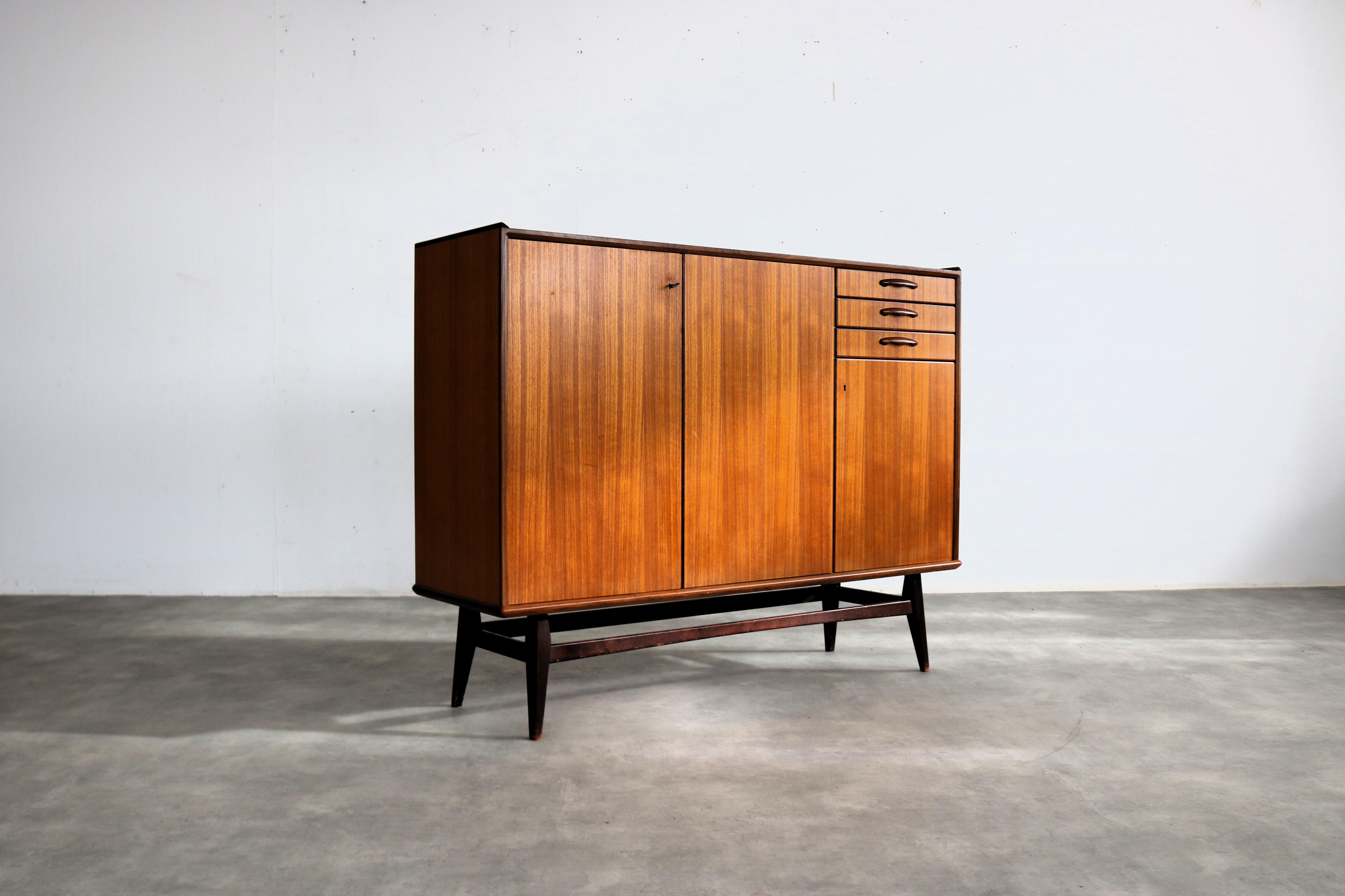 vintage sideboard  wall cupboard  60s  Swedish

period  60's
design  unknown  Sweden
condition  good  light signs of use
size  115 x 148 x 44 (hxwxd)

details  teak; glass;

article number  2544