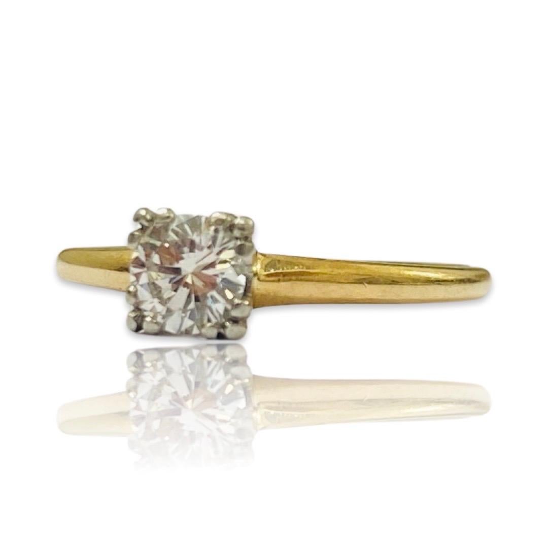 Vintage Signed 0.45 Carat Round Diamond Engagement Ring 14k Gold. The diamond is round, cut beautiful, full of life and sparkle. The color is estimated to be F with the clarity of a VVS natural earth mind diamond. The ring is a size 7 and weighs a