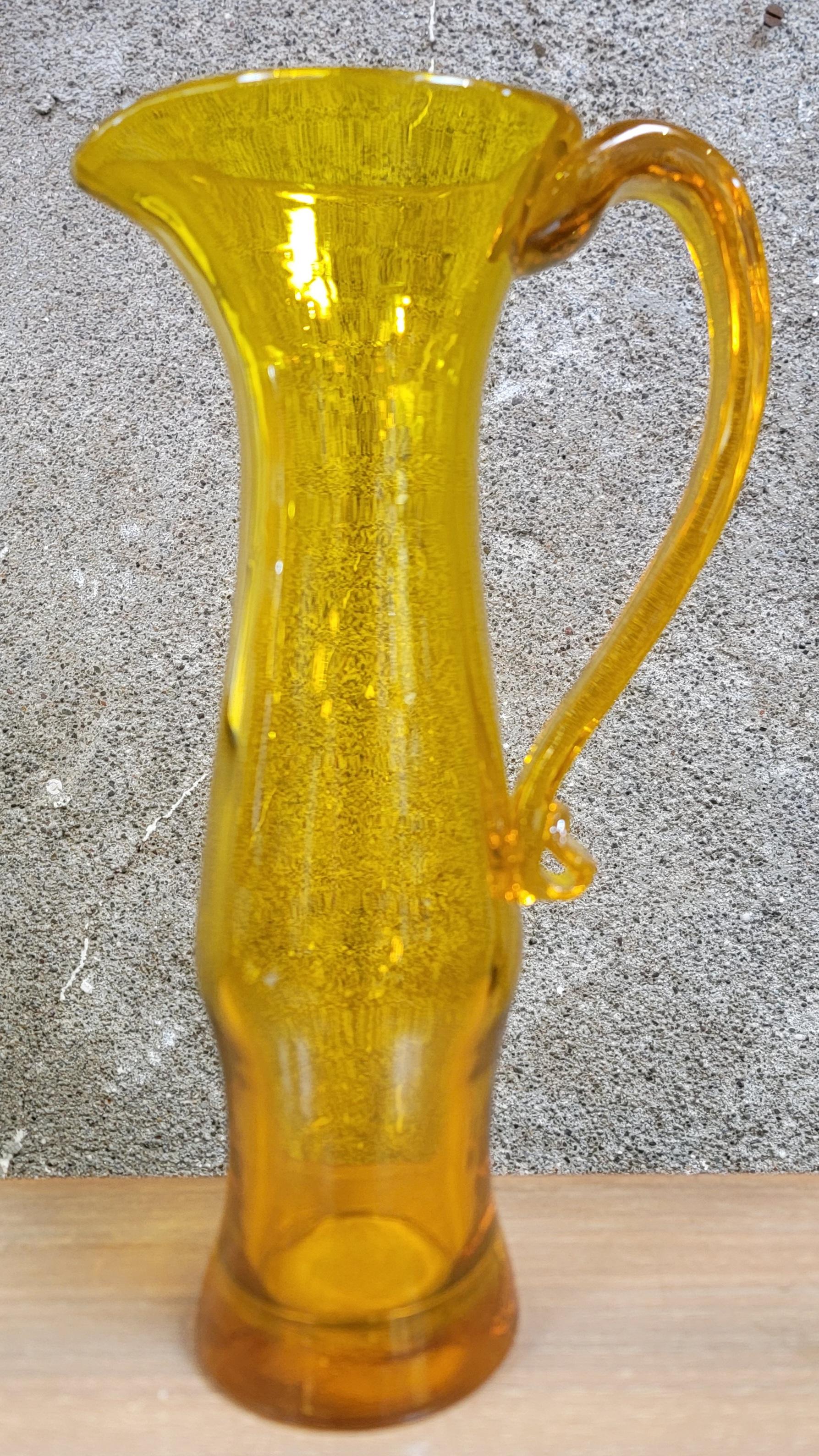 Blenko hand crafted glass pitcher with applied handle. Signed on base 