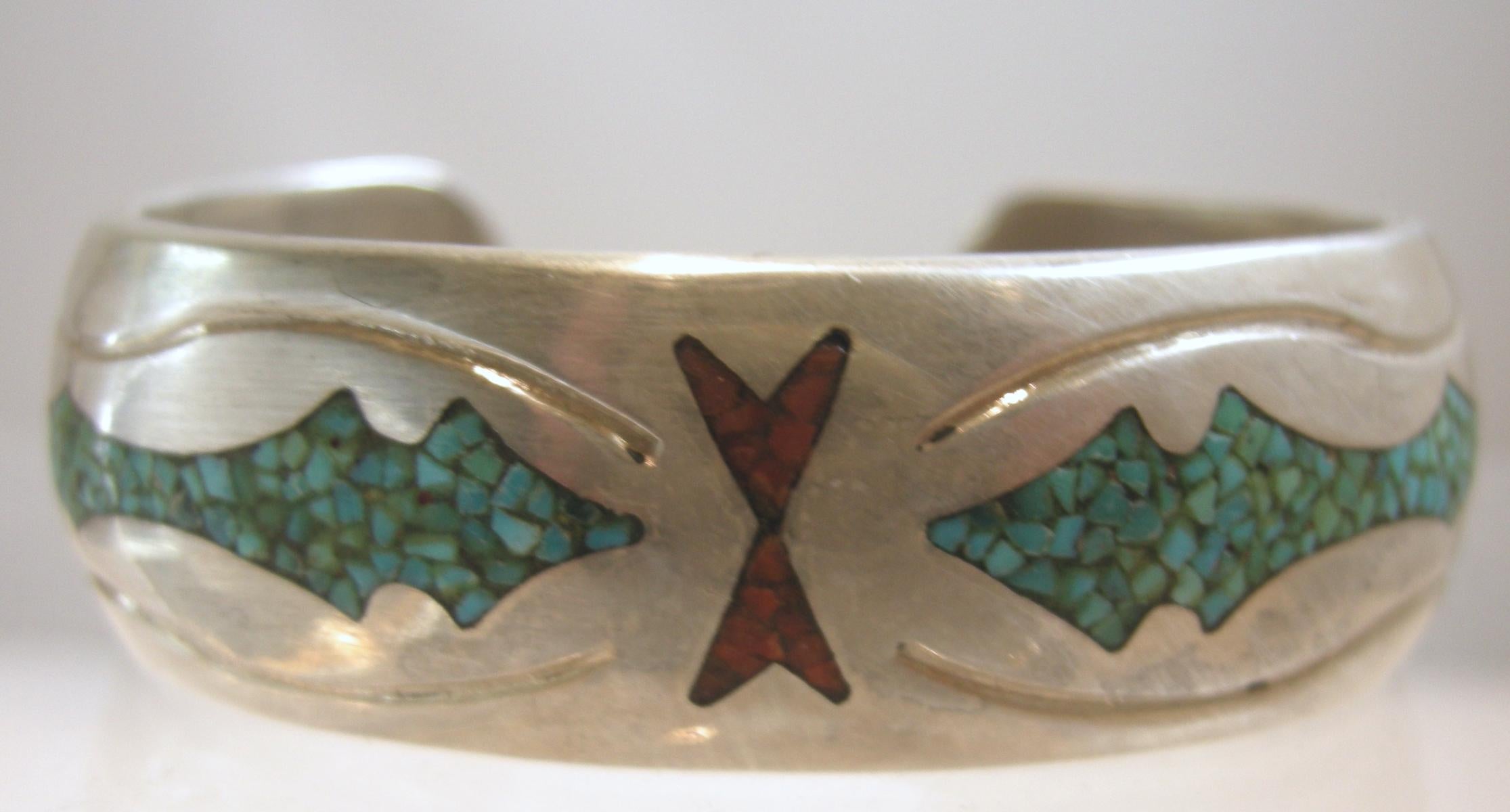 This vintage signed CLJ Navajo cuff combines turquoise & coral inlay onto a sterling silver bracelet.   In excellent condition, this piece measures 6” around the inside x 3/4” and is signed “CLJ NAVAJO”.