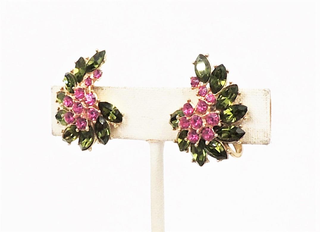 Circa early 1950s goldtone round faux-ruby and marquise faux-peridot clip earrings. Marked crown 