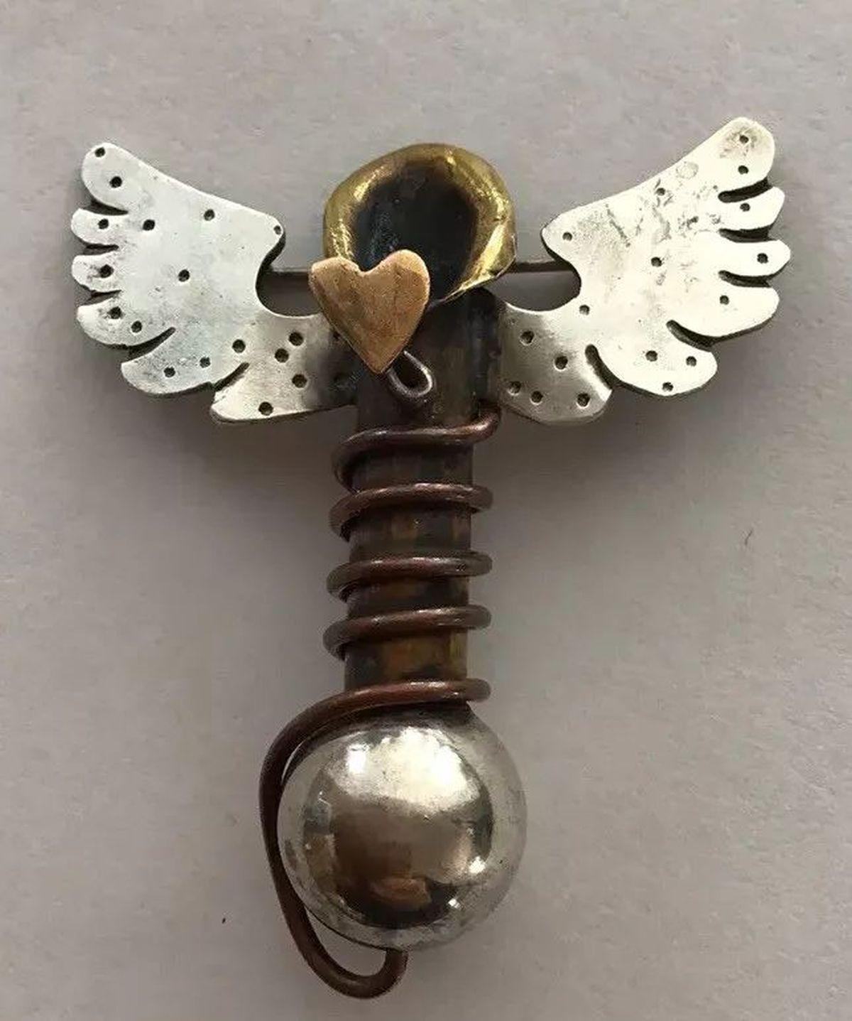 Simply Wonderful! Featuring Signed Designer Thomas Man’s Techno Romantic Heart Angel Wings Sterling Silver Brooch Pin. Hand Crafted, well-detailed Metal Art using mixed metals in Sterling Silver, Brass, Copper, Gold. Measuring approx. 2” x 2”.