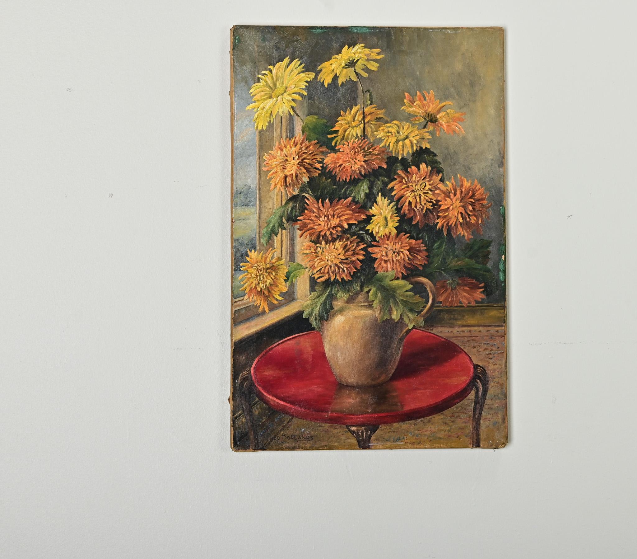 A mid-20th century oil on canvas still life painting of chrysanthemums signed by the artist, Fred Bollands. Here, the artist has captured the dense blooms in autumnal tones–set off by the red table–but also respecting the romantic tranquility of an