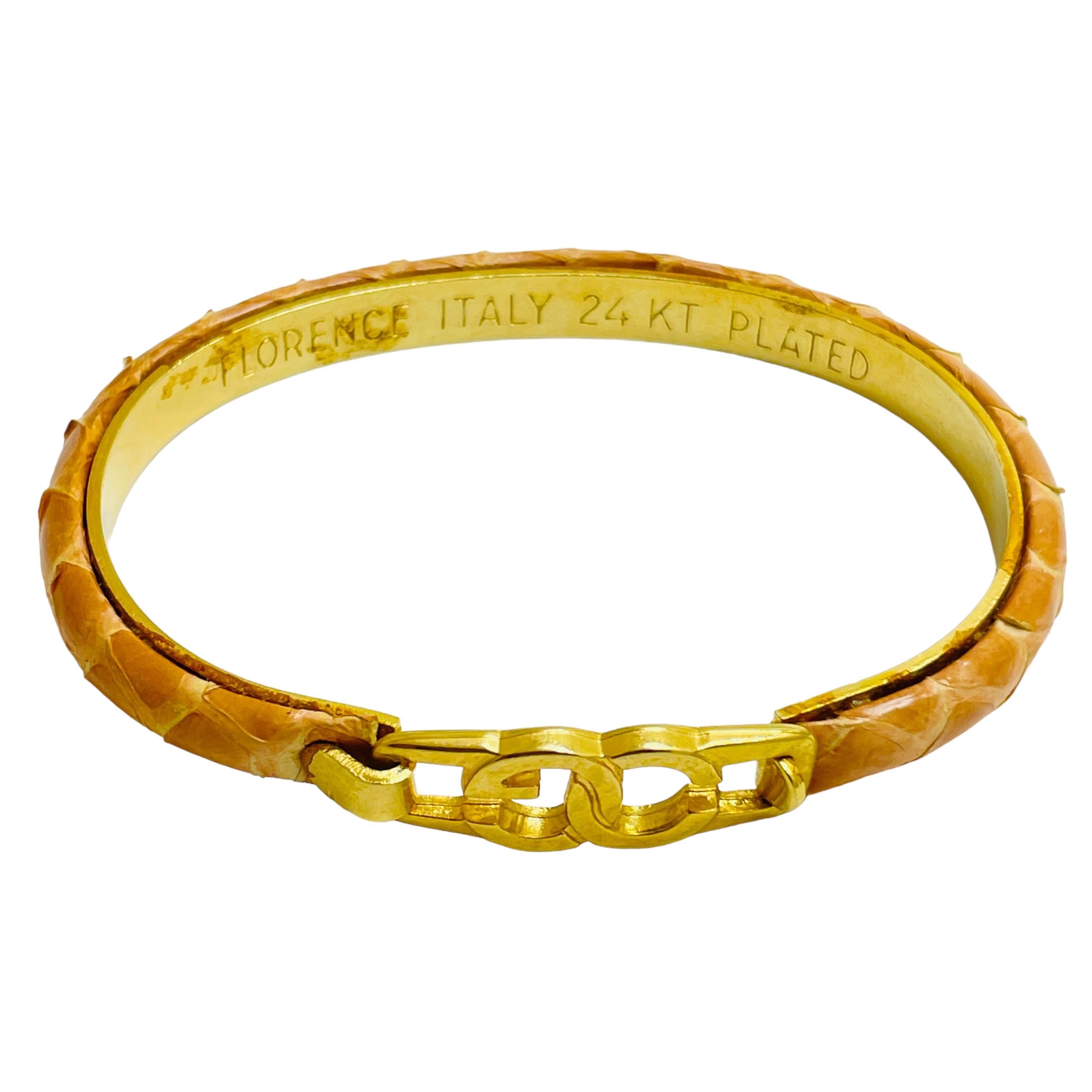 DETAILS

• signed FLORENCE Italy 24k plated   

• gold tone snake skin

• vintage designer bracelet

MEASUREMENTS  

• will fit wrist up to size 7”

CONDITION

•  very good vintage condition with minimal signs of wear 

 Sku 43

❤️❤️  VINTAGE
