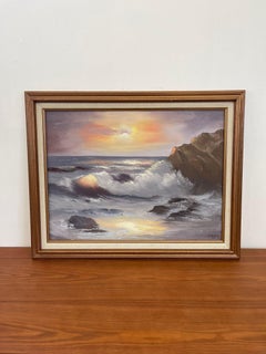 Opera d'arte d'epoca firmata e incorniciata con paesaggio sull'oceano.