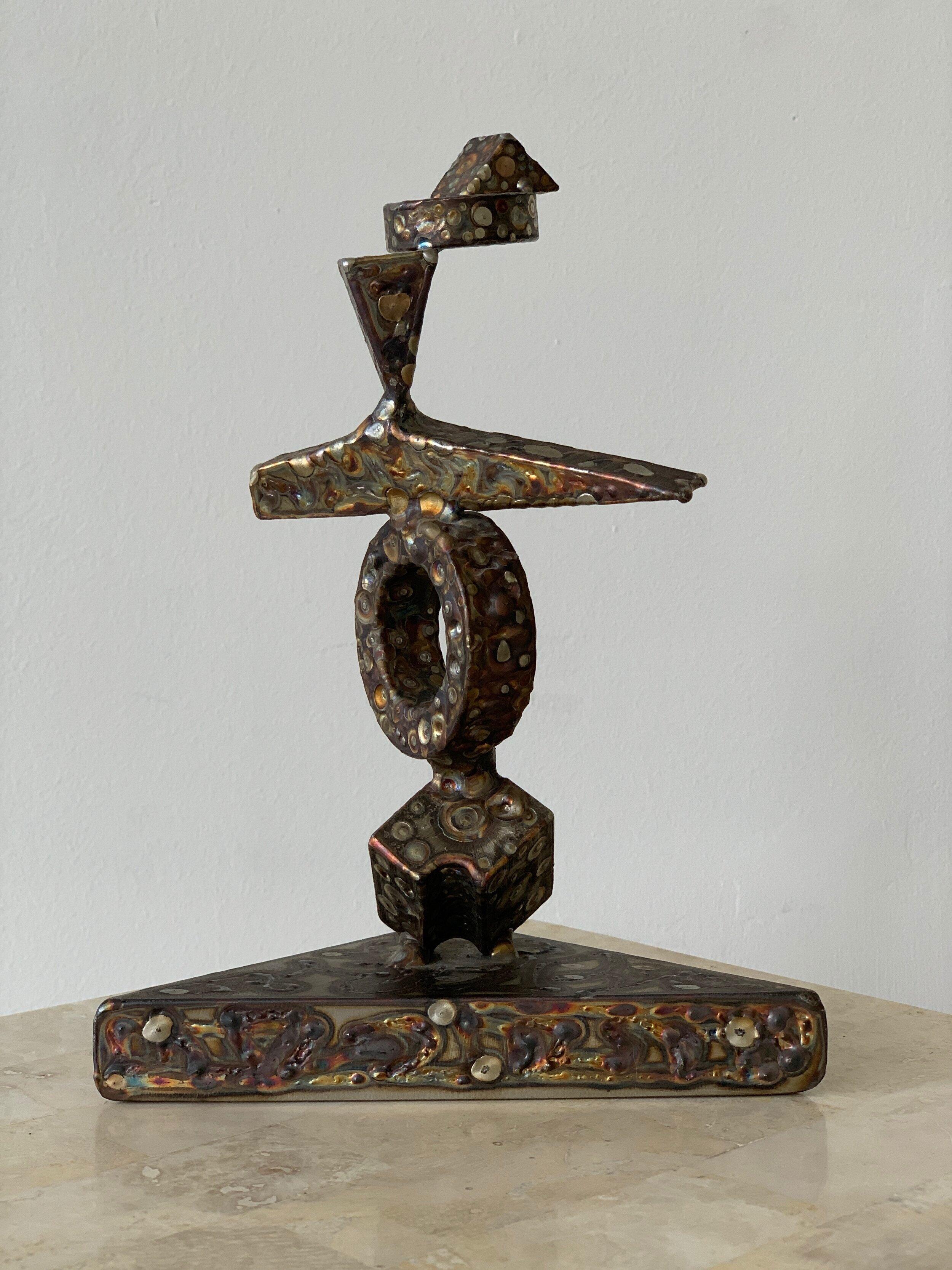 Extremely rare work by renowned Chicago modern artist, George Kafka, circa 1973. The Totem structure is formed through welded, stacked abstract shapes creating a figural image with a torch textured surface in coppery brass tones. Signed + dated by