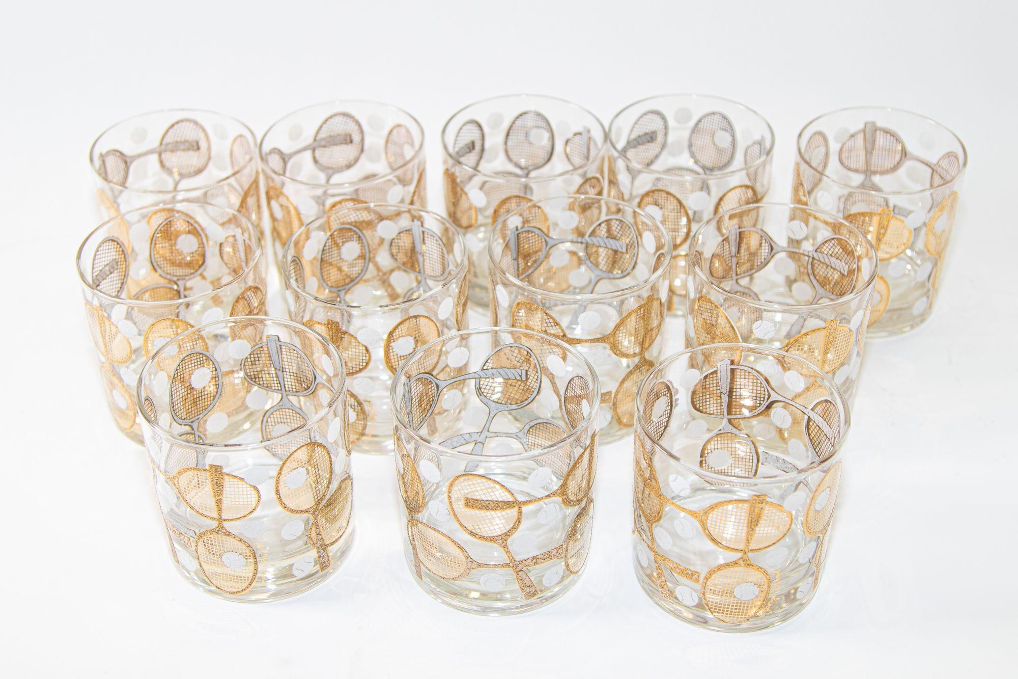Vintage signed Georges Briard barware lowball glasses with tennis rackets & tennis ball motif set of 12.
Super rare mid-20th century set of twelve rocks glasses designed and signed by Georges Briard, decorated with tennis racquets overlaid with 22