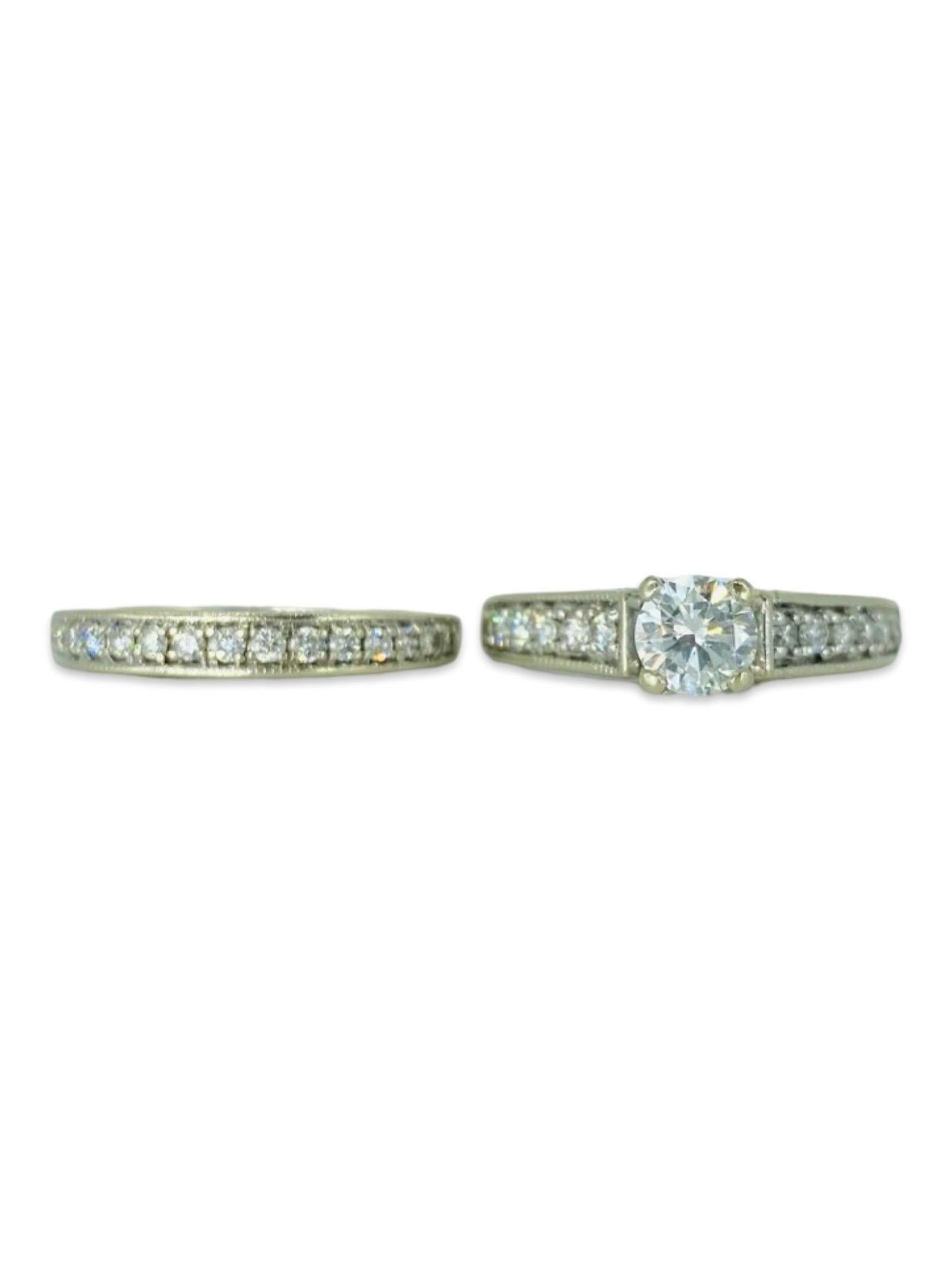 Vintage Signed GIA Certified 0.50 Carat E/VS2 Diamond Center Engagement Ring Set. The ring features side diamonds totaling approx 0.50tcw for both rings. The center round cut diamond is natural and GIA certified E color and VS2 clarity and comes