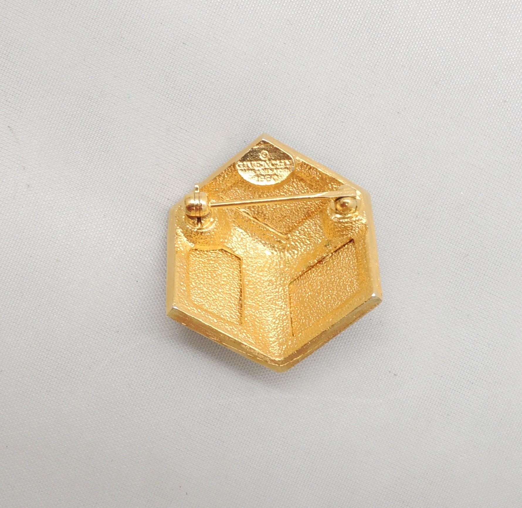 Goldtone 3d cube with black and red resin brooch with security clasp. Marked 