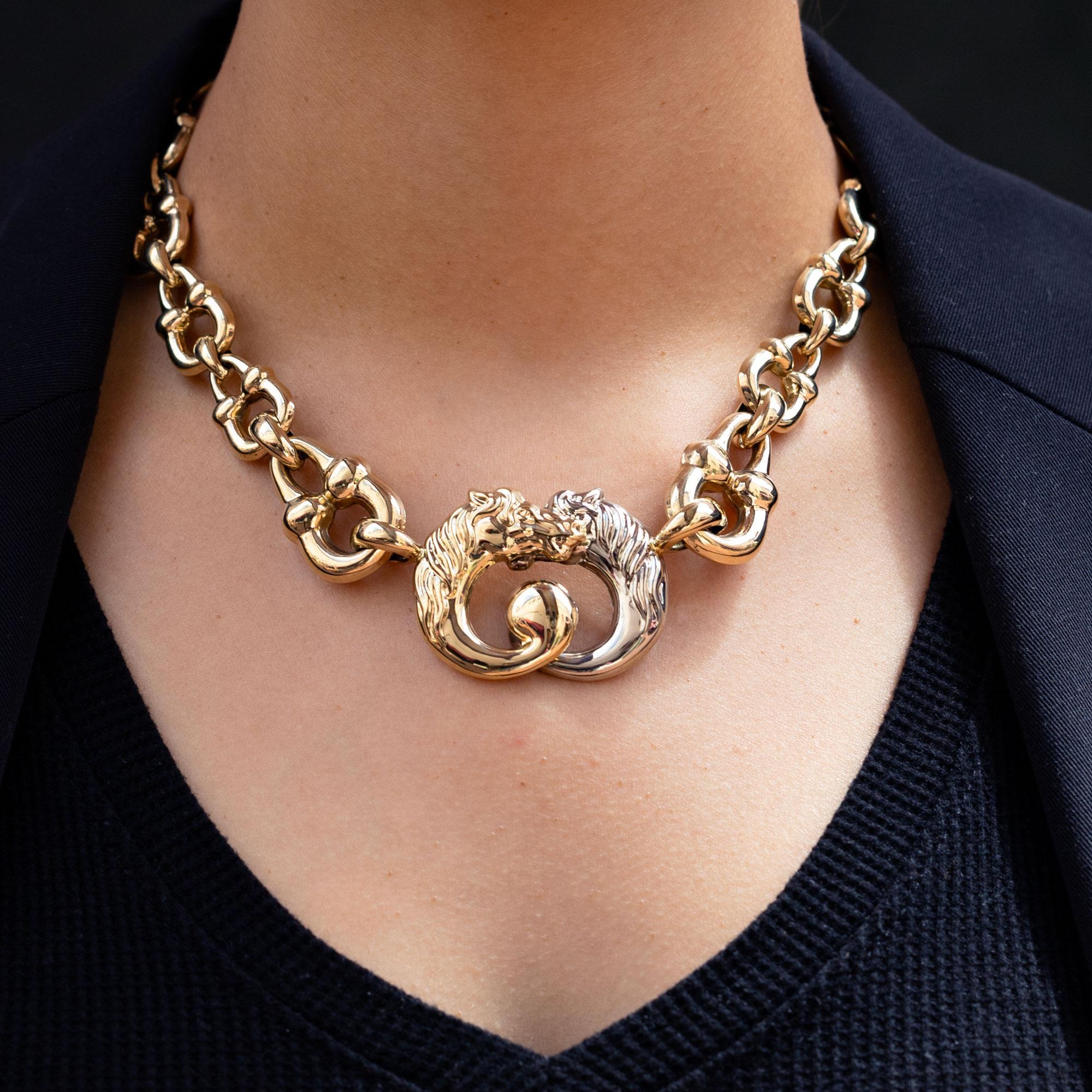 Express your inner aesthete with this elegant equestrian horse-bit necklace, signed from Italian designer Bassani, in the manner of Gucci. This vintage necklace centers on a pair of powerful steeds in an embrace and showcases 14 karat gold horse bit