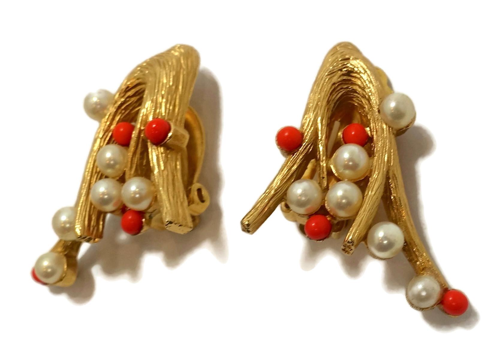 These vintage signed Joseph Mazer earrings have  faux pearls and faux coral beads in a gold tone setting.  In excellent condition, these clip earrings measure 1-3/8” x 3/4” and are signed “Joseph Mazer”.