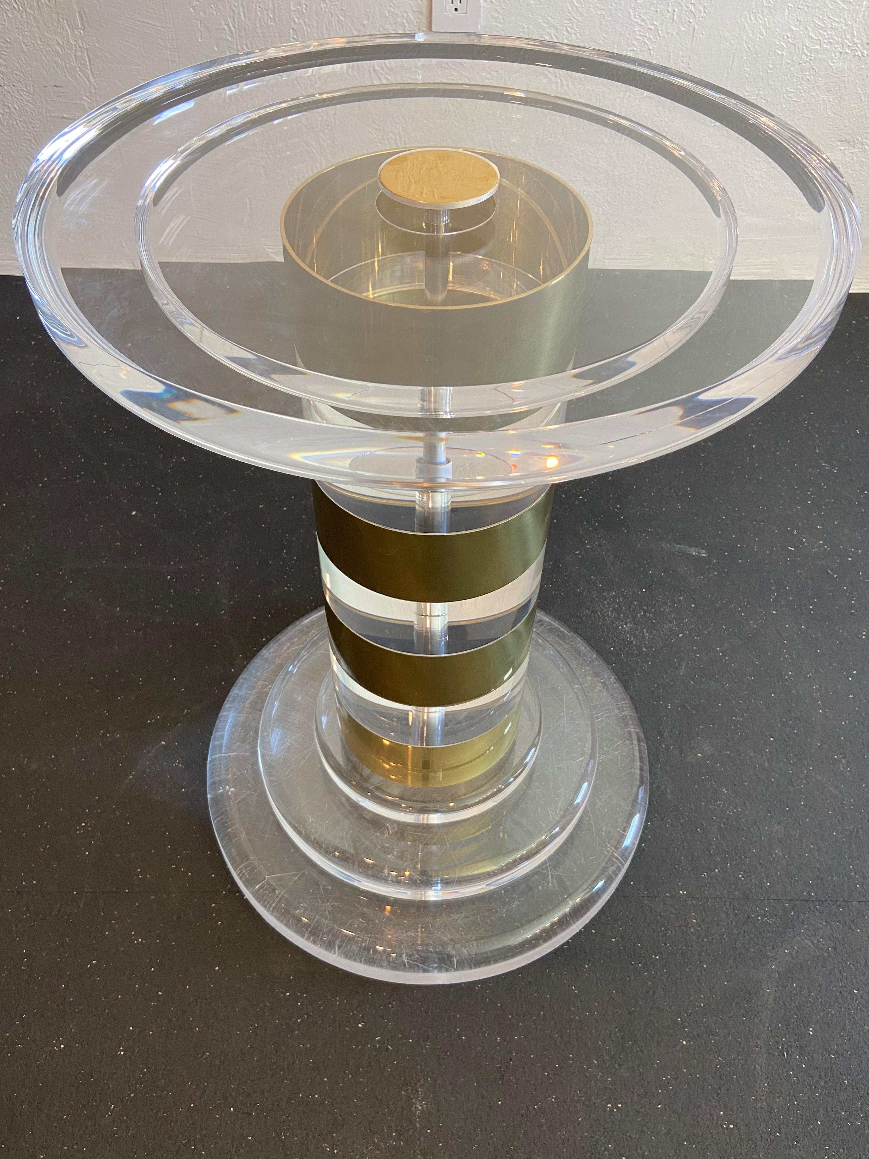 Vintage signed lion in frost lucite and brass pedestal table base. Scratches to bottom side of table from use throughout the years (please refer to photos). A glass top is not included. 

Would work well in a variety of interiors such as modern,