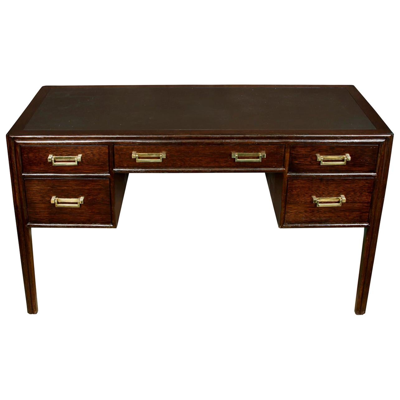 Vintage signed McGuire Campaign wood desk with rattan detail.