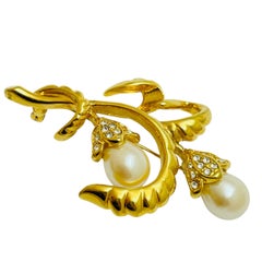 Broche de diseño flor de cristales dorados firmado vintage MONET