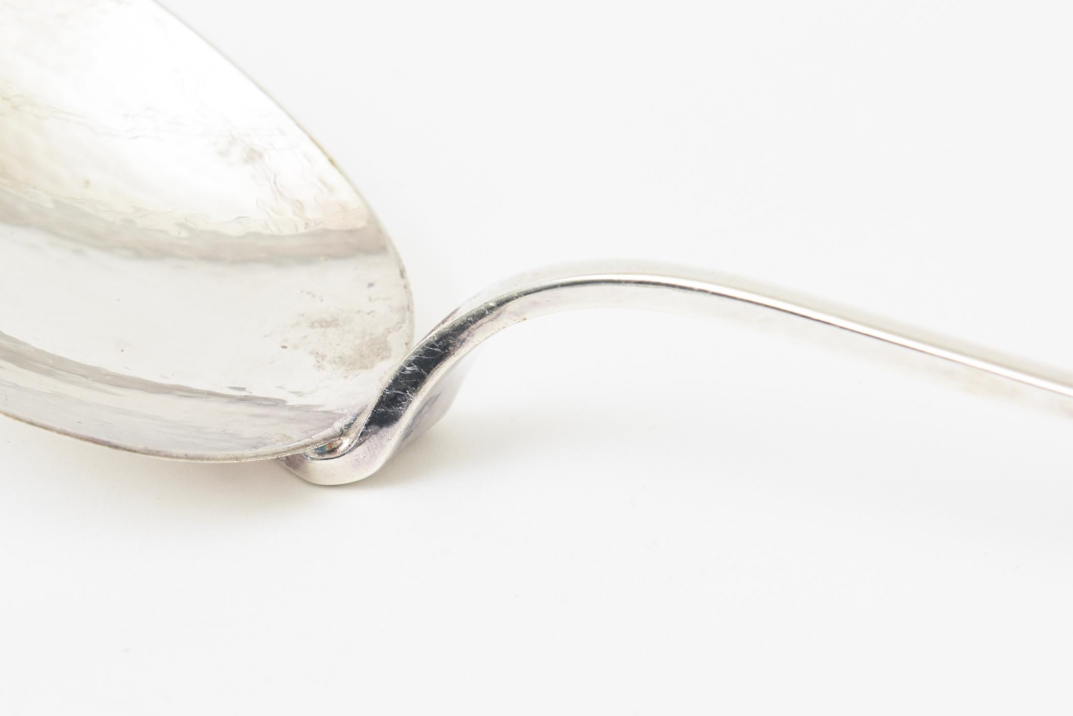 These arresting vintage monumental over scale hand hammered and hand wrought signed salad servers or serving pieces have great weight and length. Signed Marilena Mariotto. From the 80's. They can be dramatic salad servers and wonderful for