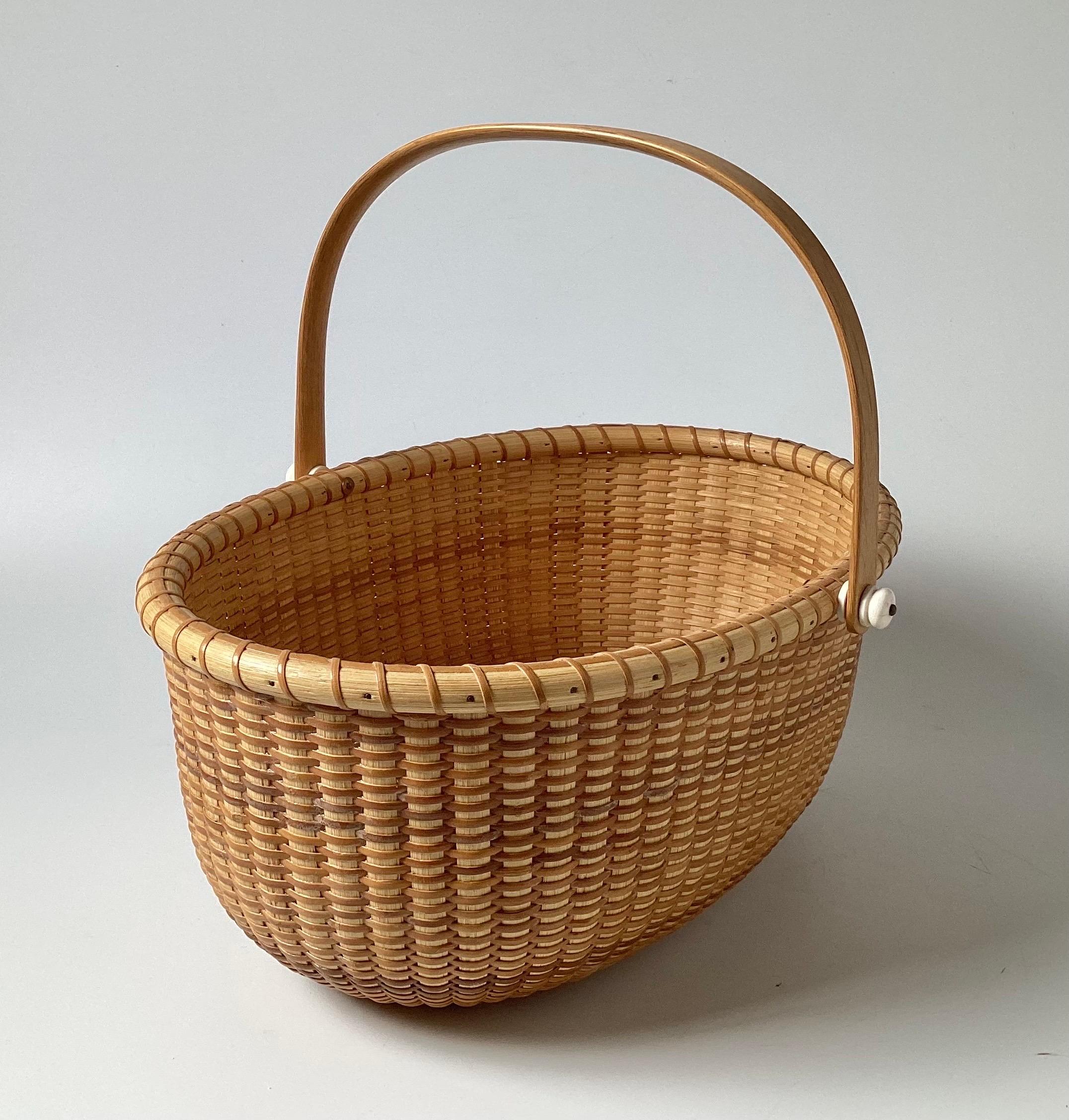 North American Vintage Signed Nantucket Basket with Handle For Sale