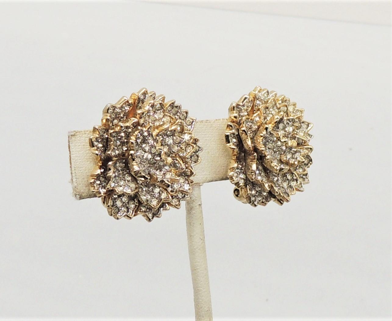1950s goldtone pave clear rhinestone 3d flower clip earrings. Marked 