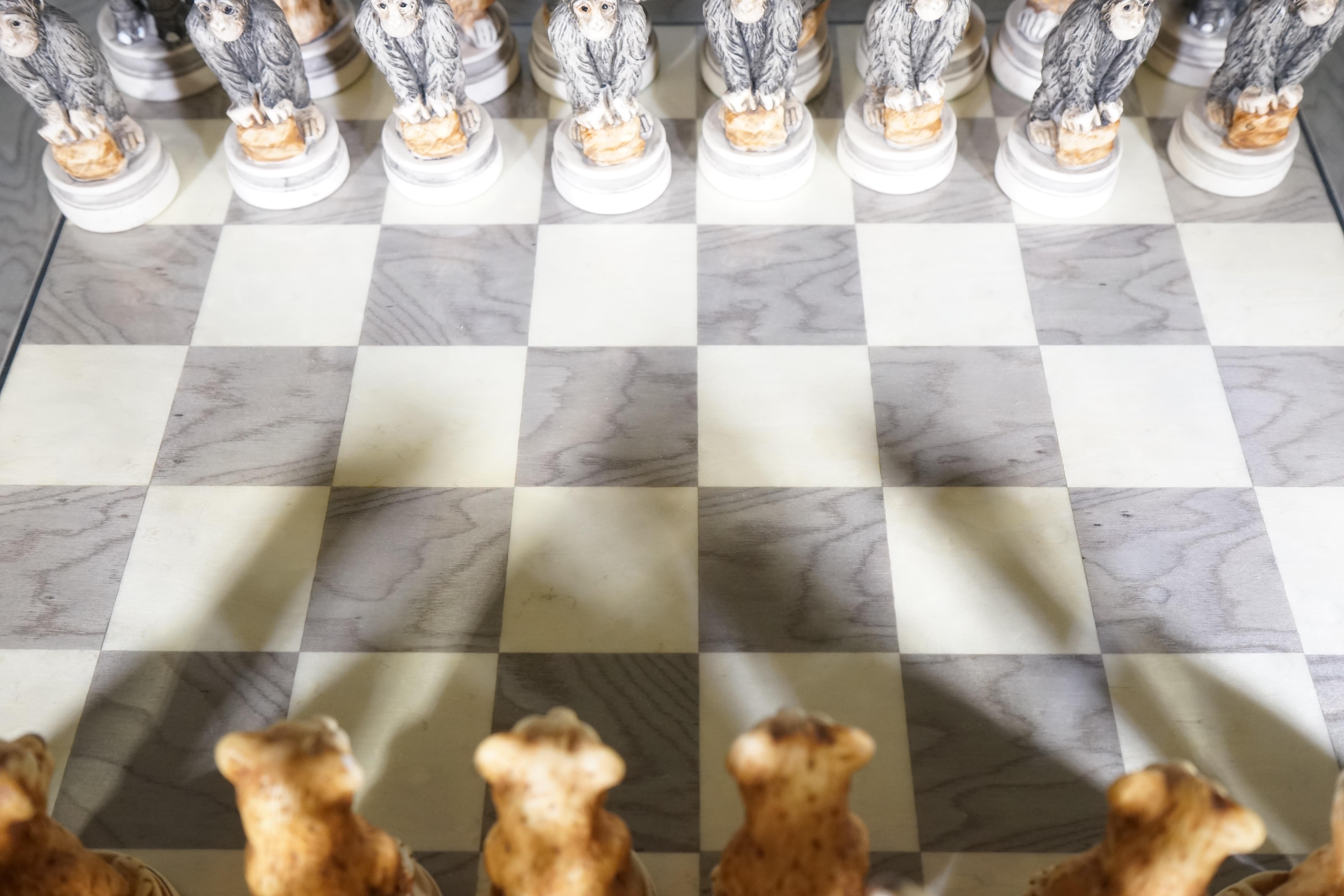 Vintage signed Nigri animal kingdom chess set. Entirely hand painted and signed. Pieces vary in size with a wooden chessboard. Animal chess pieces range from tigers, lions, snakes, monkeys elephants, and more. Very rare.
