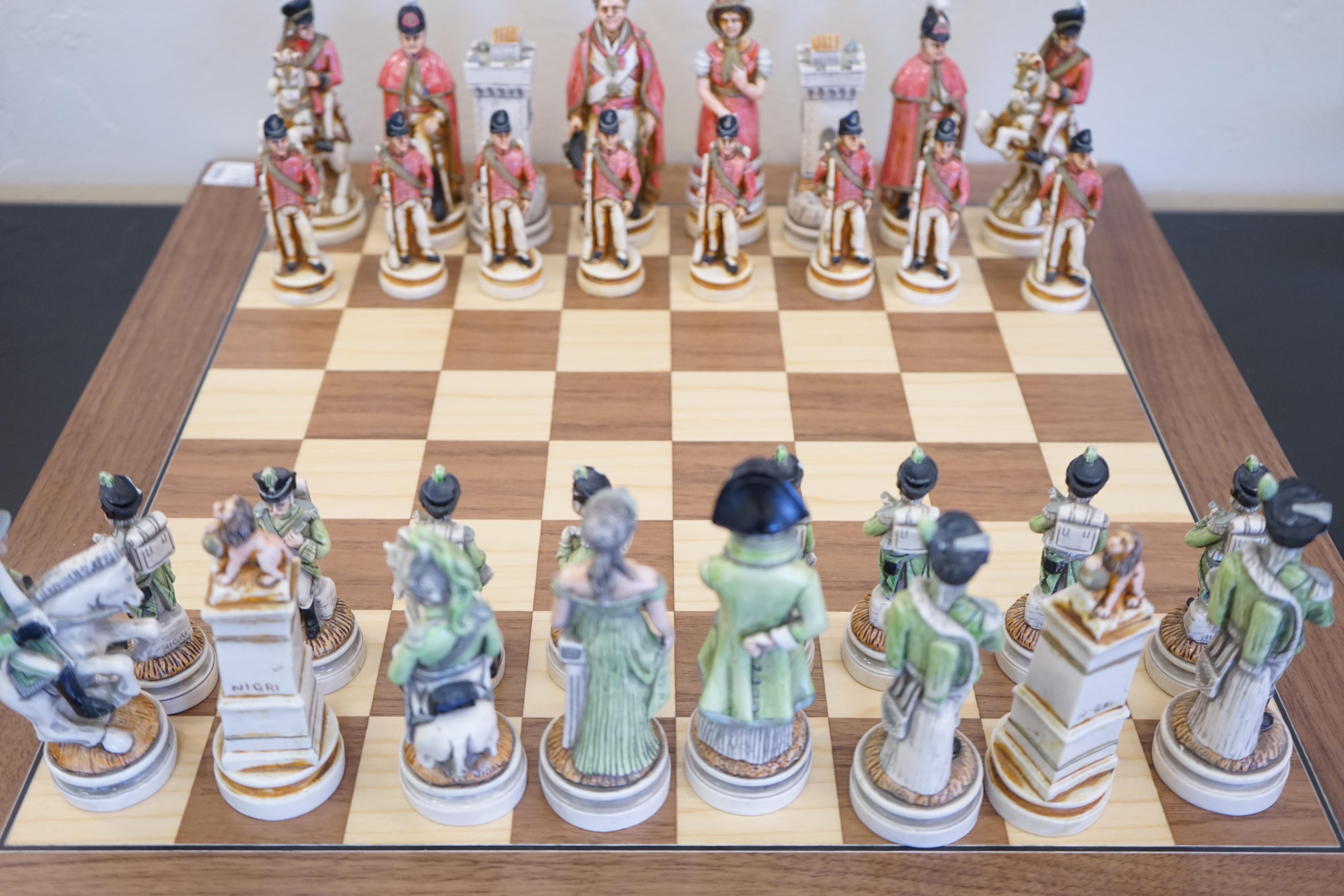 Vintage signed Nigri Napoleon Empire chess set, with a battle of Waterloo theme. Entirely hand painted and signed. Pieces vary in size with a wooden chessboard.