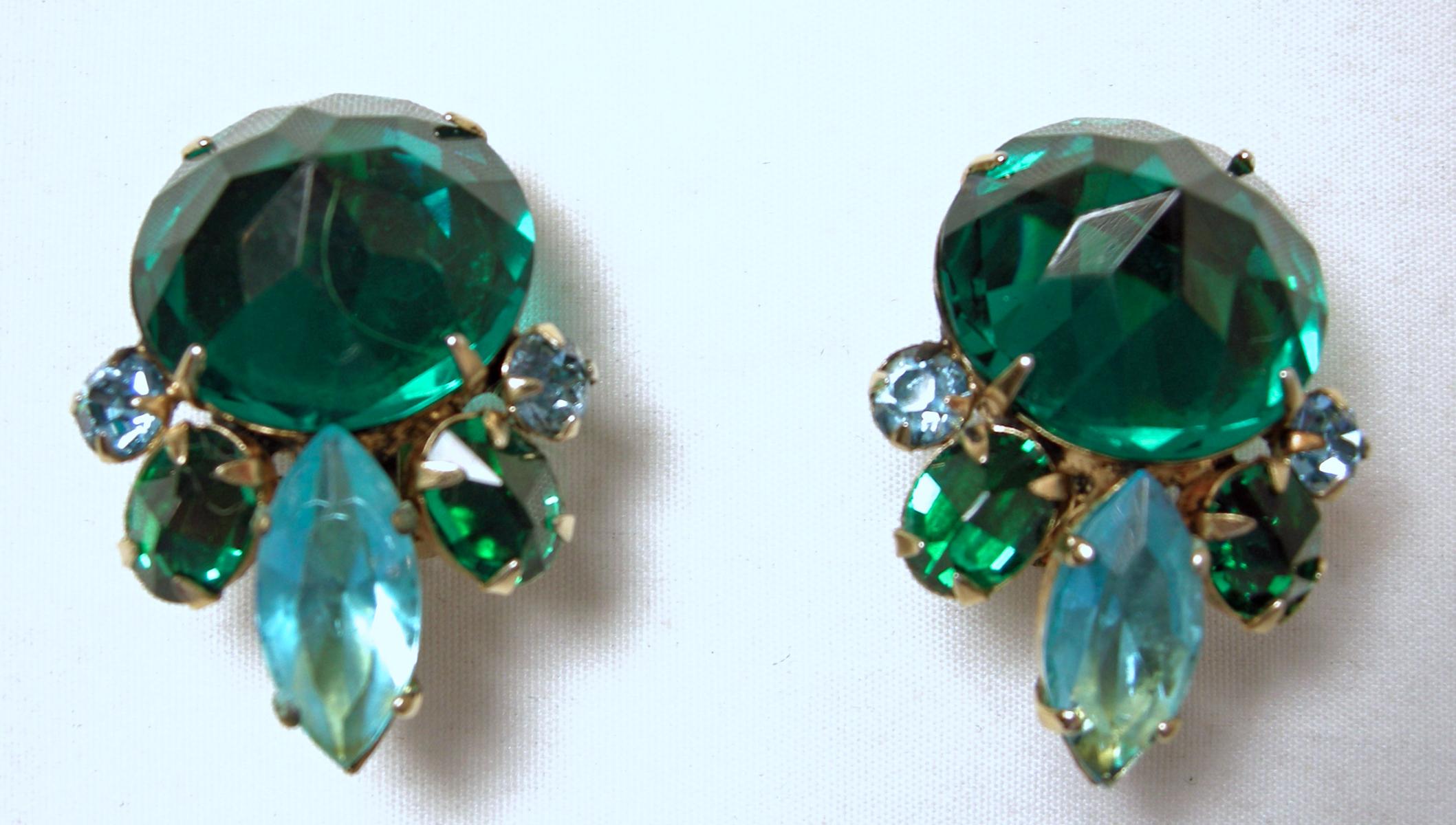 It’s so rare to find a Schreiner set, but here we have a stunning brooch and earrings with green crystals and hues of blue/green crystals in a gold tone setting.  The brooch measures 2-1/2” in diameter/across.  The matching clip earrings are 1-1/4”
