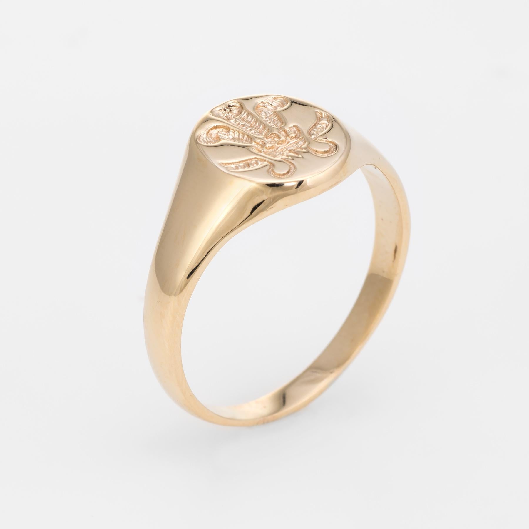 Finely detailed vintage signet ring, crafted in 9 karat yellow gold. 

A reverse intaglio of the Prince of Wales feathers is set into the oval signet mount. The Prince of Wales's feathers is the heraldic bade of the Prince of Wales. It consists of